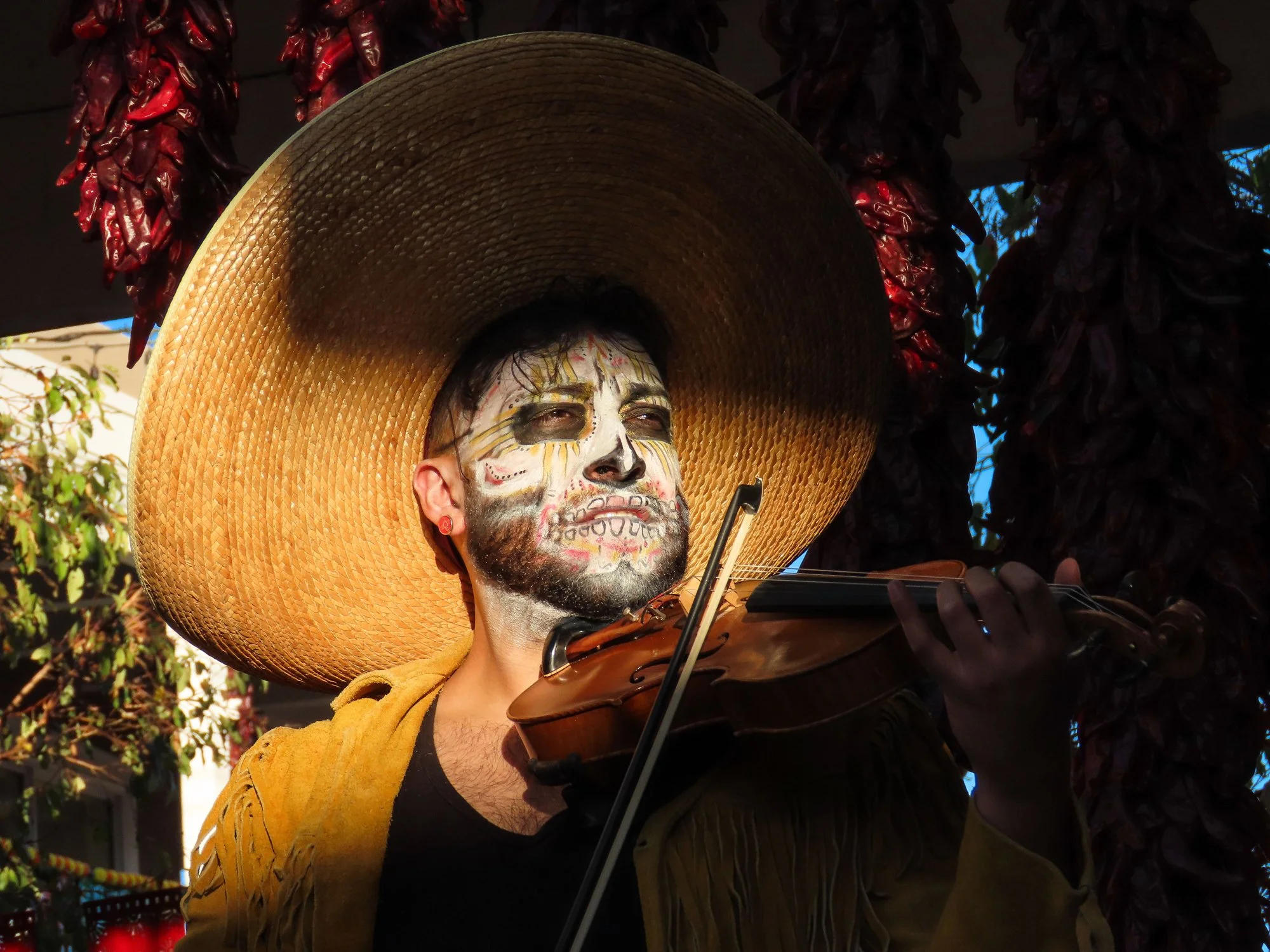 PEOPLE 2ND PLACE: STEPHANIE NIETO - 
"Sunset Symphony." In Old Town Albuquerque's plaza, Mariachi musician Michael Chavez serenades the people with his soulful violin and brilliant vocals. As the music fills the evening air, he gets lost in the rhyth