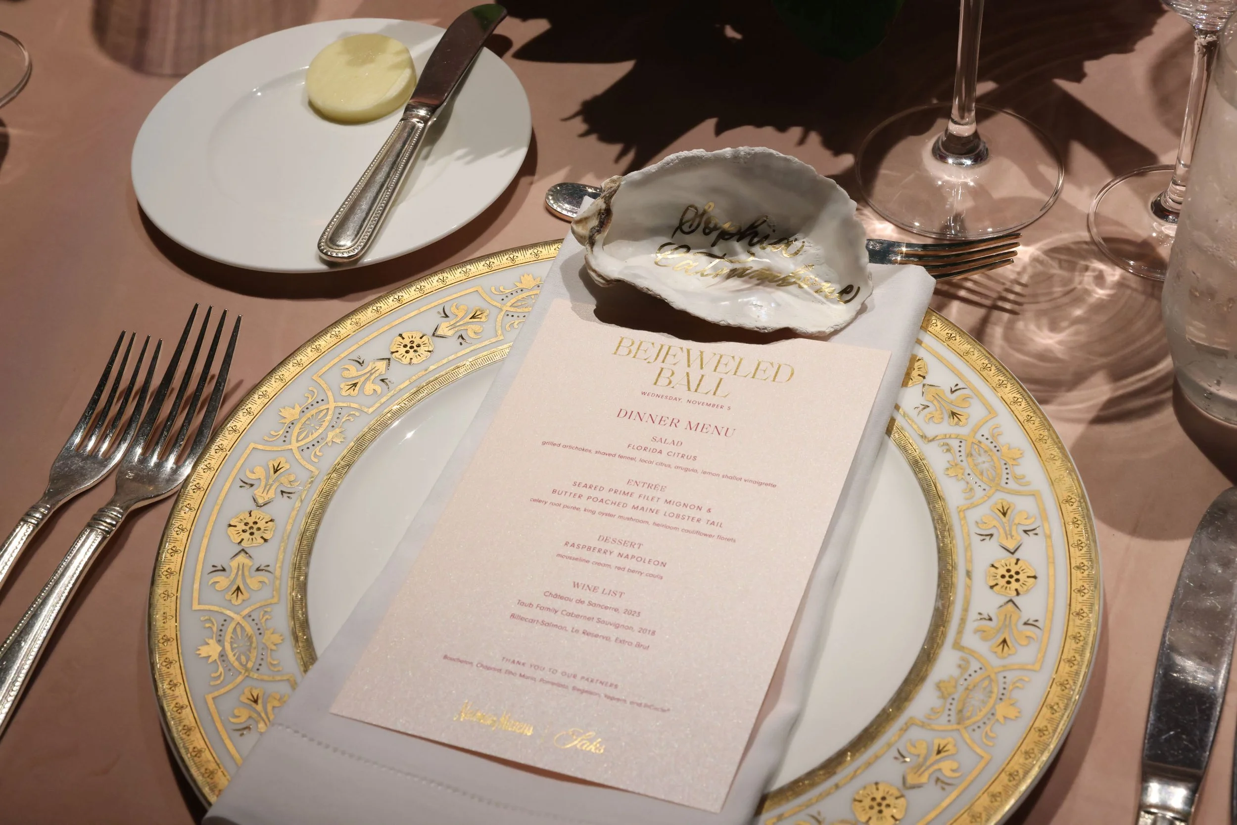 Gold Luxury calligraphy on an oyster shell place card for a private luxury event at the FAENA hotel in Miami Beach