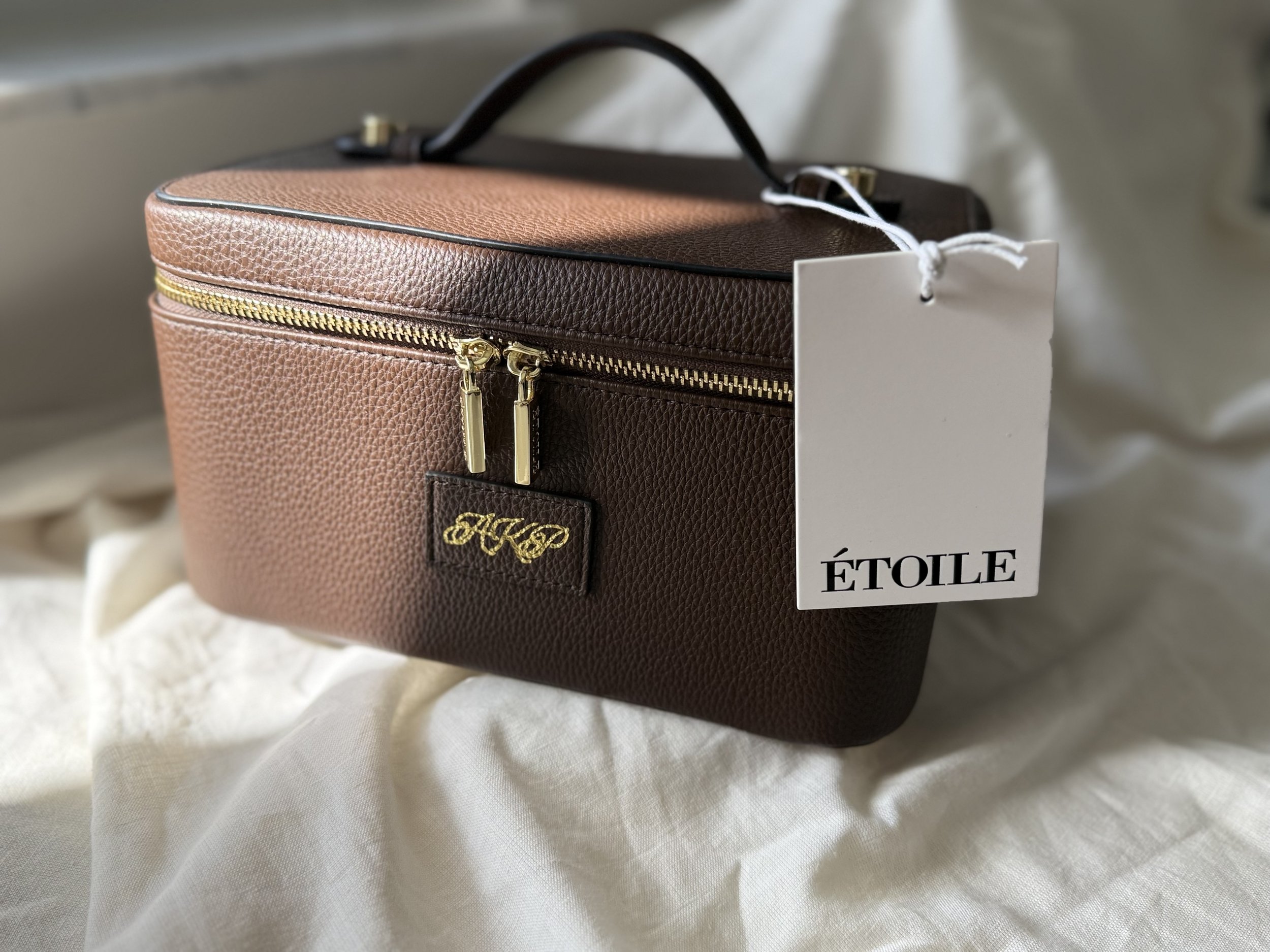 Etoile hand debossed monogram on the train travel bag