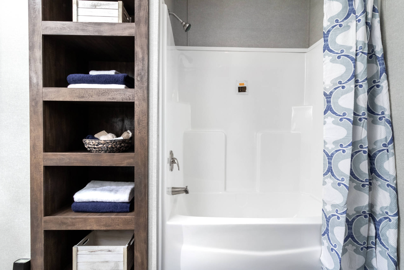 Bathroom with shower and towel shelves