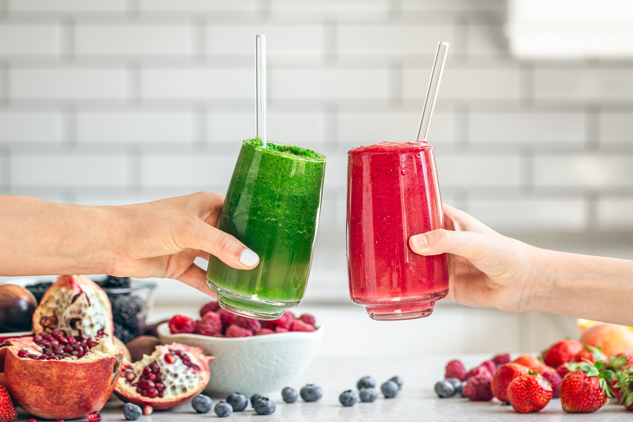 glasses-with-green-and-red-smoothies-in-female-han-2023-11-27-05-31-12-utc.jpeg