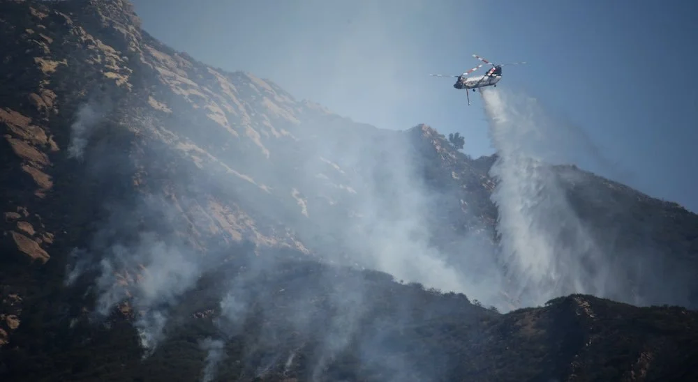 Helicopter putting out fire