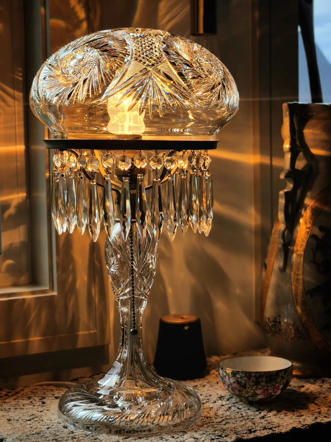 My favorite piece in my collection.

An antique American Brilliant Period cut glass lamp that turns evening light into something almost magical. The craftsmanship is remarkable, but it's the way it fills a room with pattern and atmosphere that keeps 