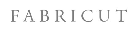Close-up of the word 'FABRICUT' in grey capital letters on a white background.