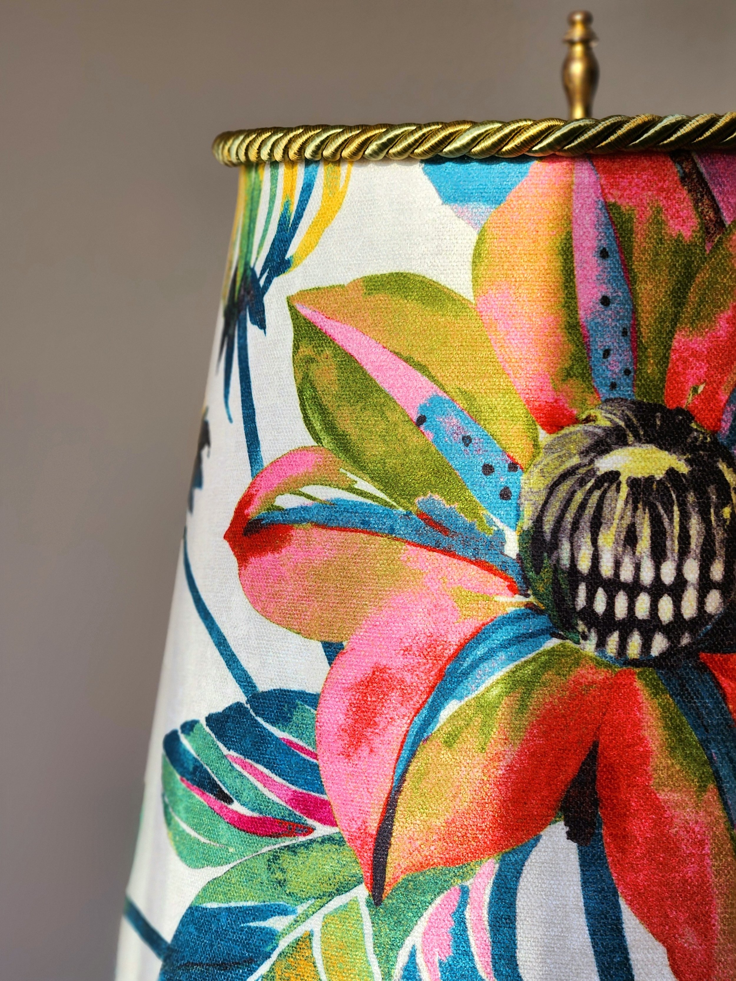 Admiral Landings Designs handcrafted lampshade with bold floral fabric and gold trim.