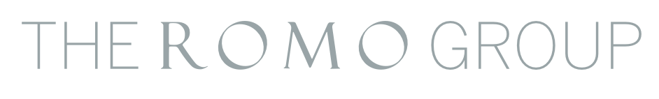 Logo with the text 'THE ROMO GROUP' in light gray letters on a white background.
