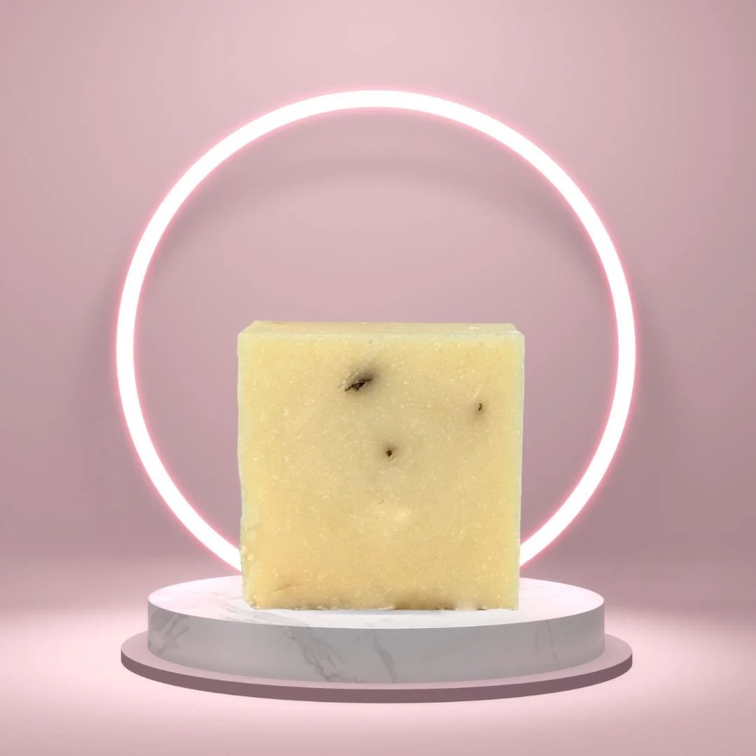 Lemongrass Soap Bar on a white pedestal with a glowing pink circle background.