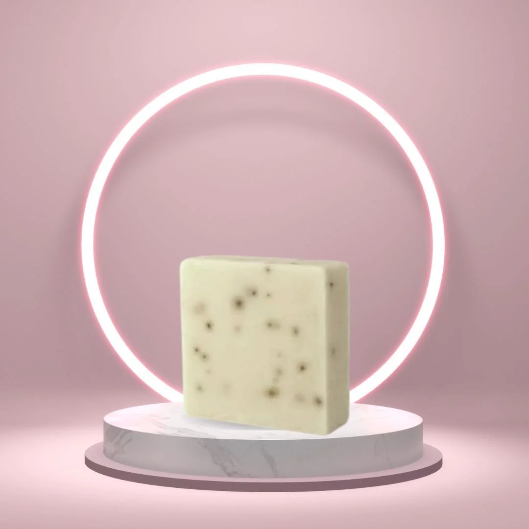 Peppermint Soap Bar on a white pedestal with a glowing pink circle background.