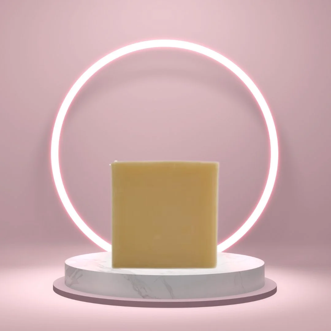 Egyptian Musk Soap Bar on a white pedestal with a glowing pink circle background.