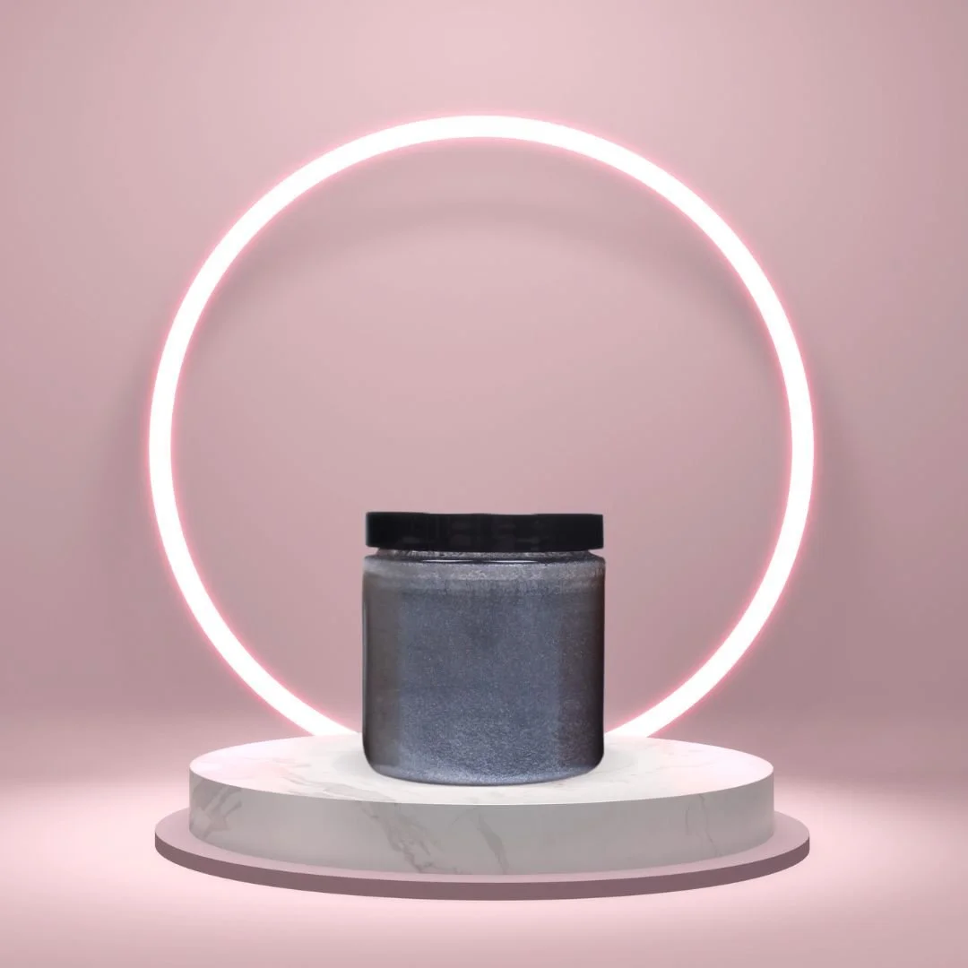 Sugar Scrub Gel on a white pedestal with a glowing pink circle against a blush studio background.