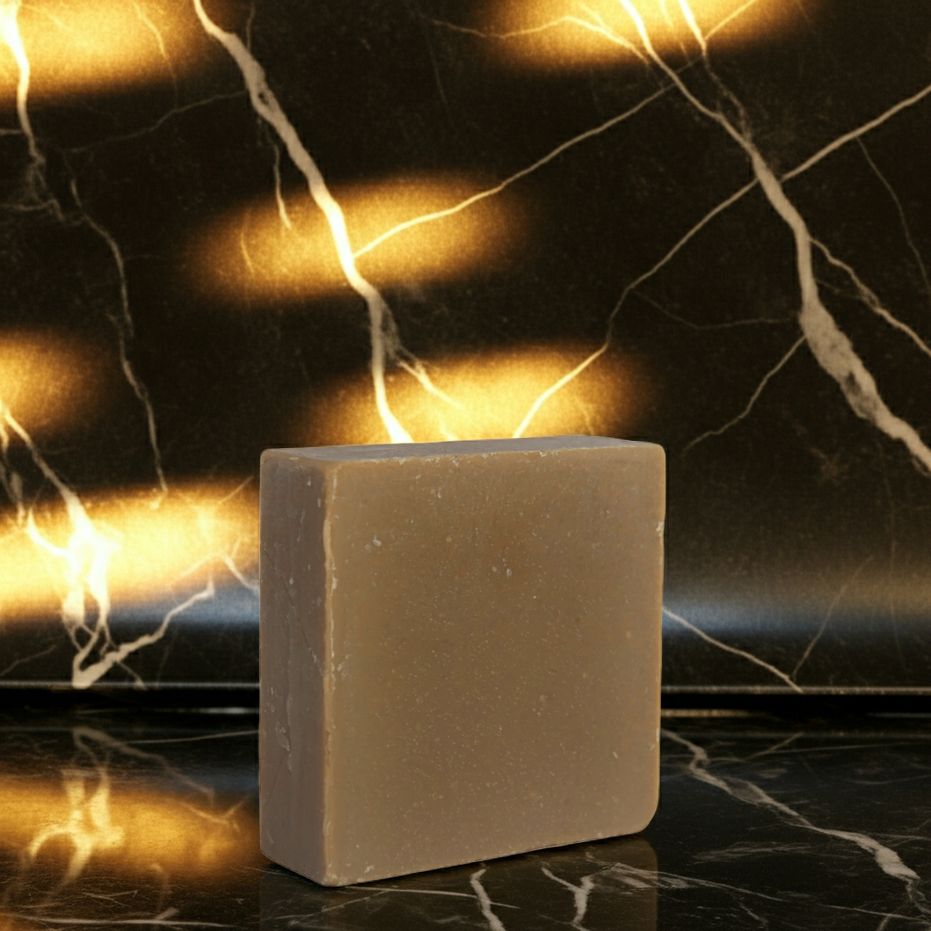 Jazz Night in Harlem handmade soap bar styled against a dark marble background with warm golden reflections
