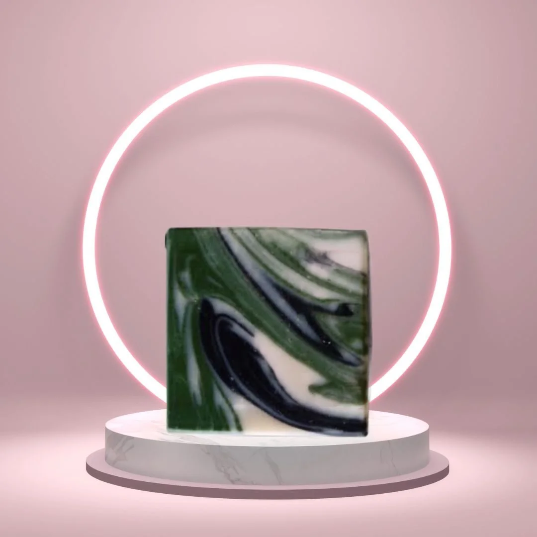 Mountain Air Soap Bar on a white pedestal with a glowing pink circle background.