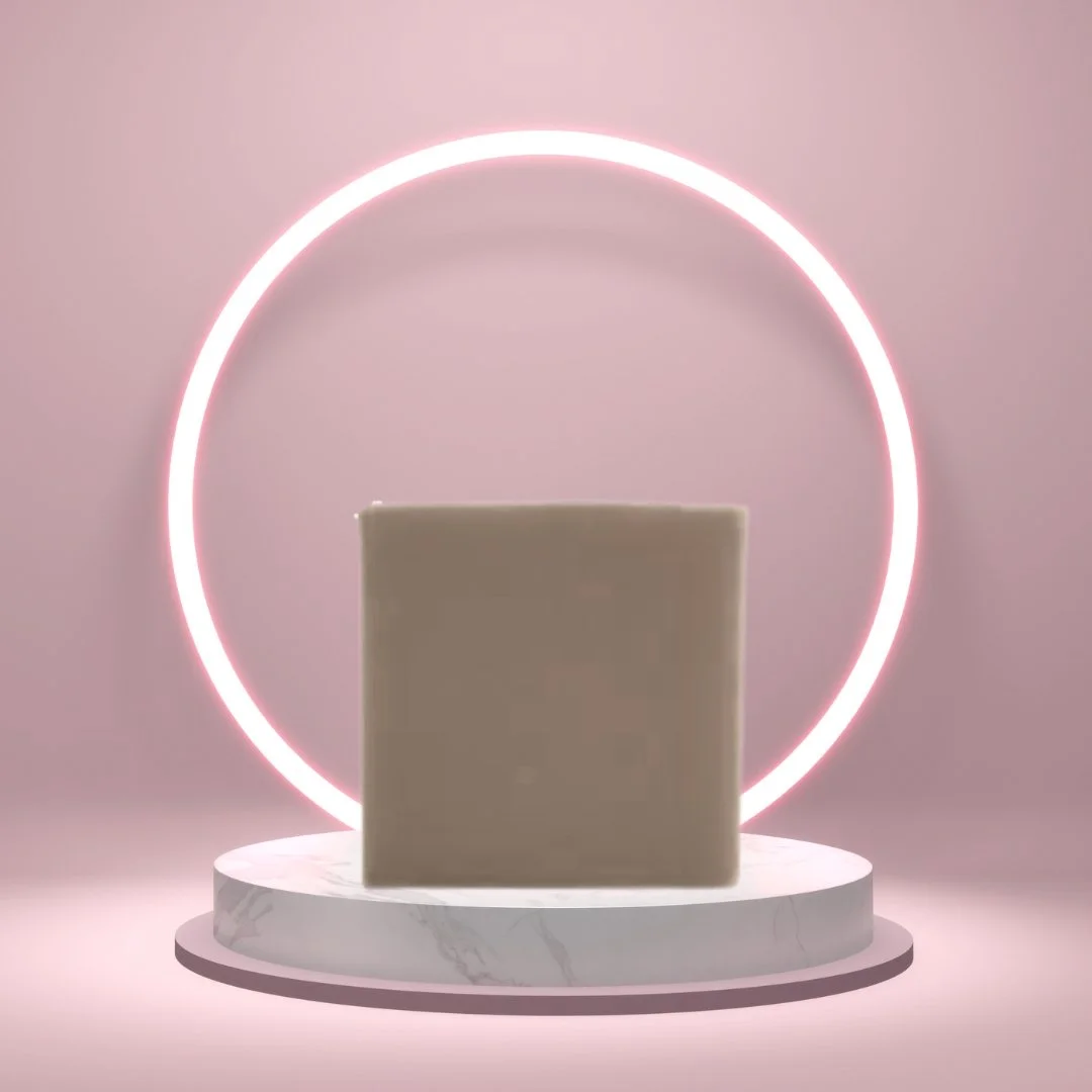 Sandalwood Soap Bar on a white pedestal with a glowing pink circle background.