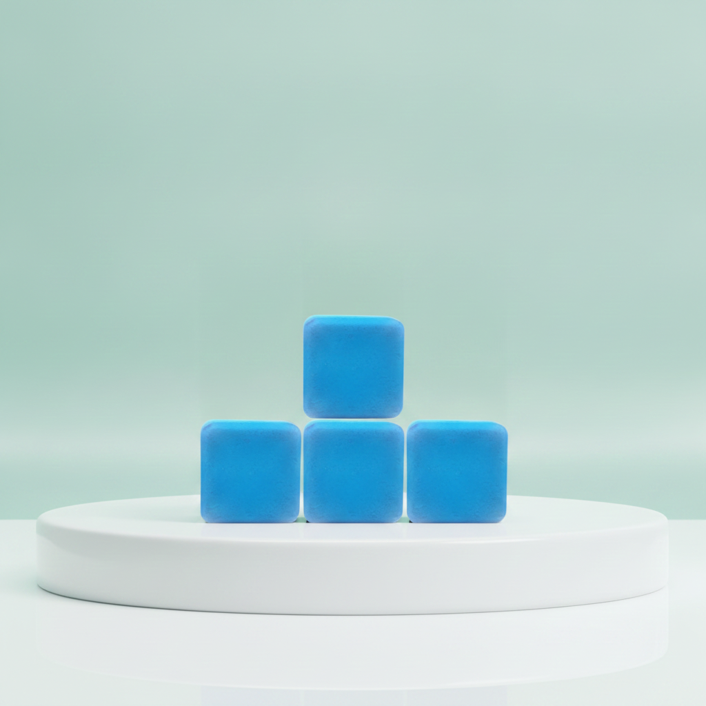 4 Pack Large Stress Relief Shower Steamers stacked on a white pedestal against a soft mint background.