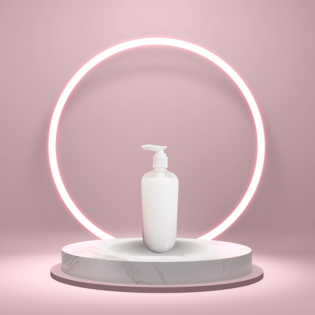 A soft studio-style hero image of Sensitive Skin Body Wash from The White Line, displayed on a pink pedestal with a glowing circular backdrop for a polished, minimal look.