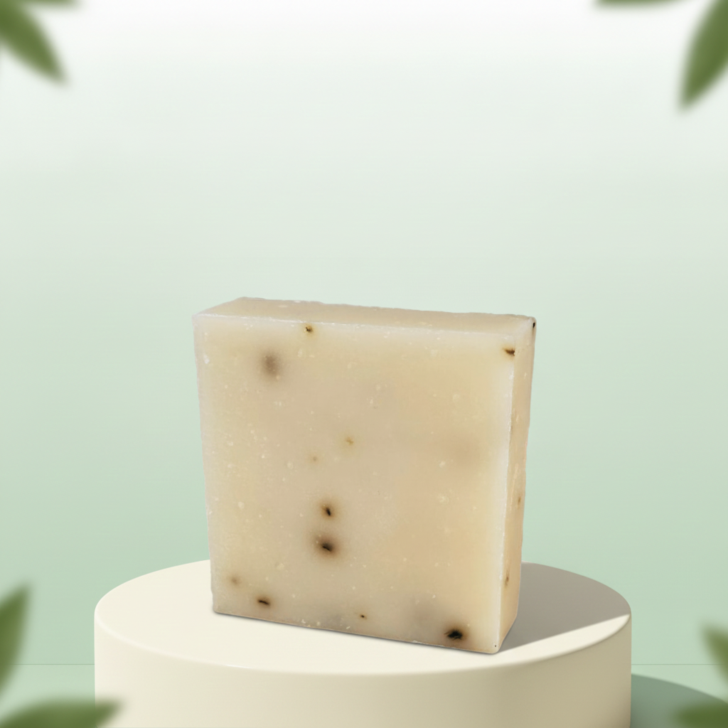 Tea Tree Mint Soap Bar on a white pedestal with a soft green background.