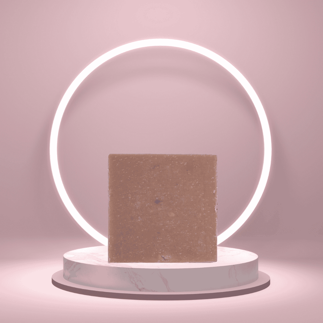 Osei Gold handmade soap bar on a pedestal with a glowing pink ring backdrop