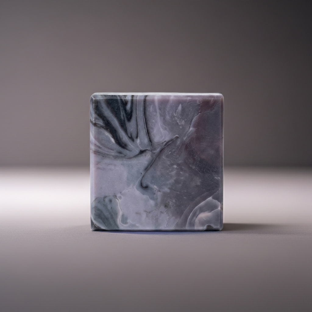 Storm Over the Sahel handmade soap bar in a clean minimal studio setting with soft gray background