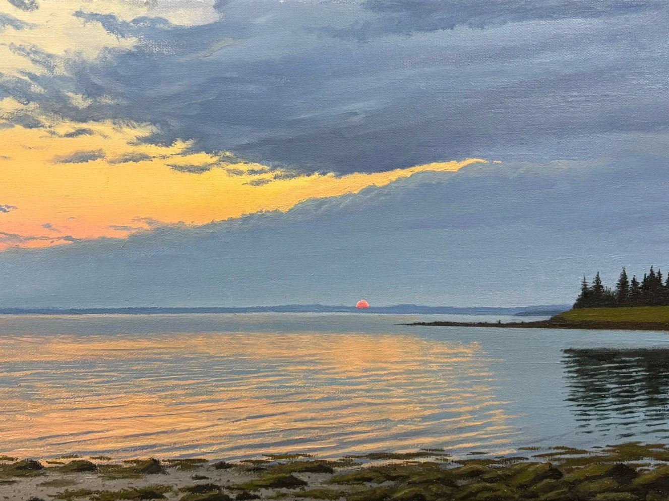 SUN&rsquo;S HAZY GOODBYE
While on an adventure in Maine, I spent a lot of time driving along the coast. I had stopped near the town of Castine to watch a sunset. I enjoyed the serenity of a rocky beach and calm waters. I relaxed at my spot for an hou