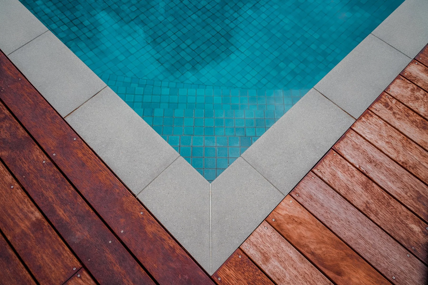 Close up view of a good sized family pool in Mount Martha (Mt Martha) on the Mornington Peninsula with blue water and lovely decking area.