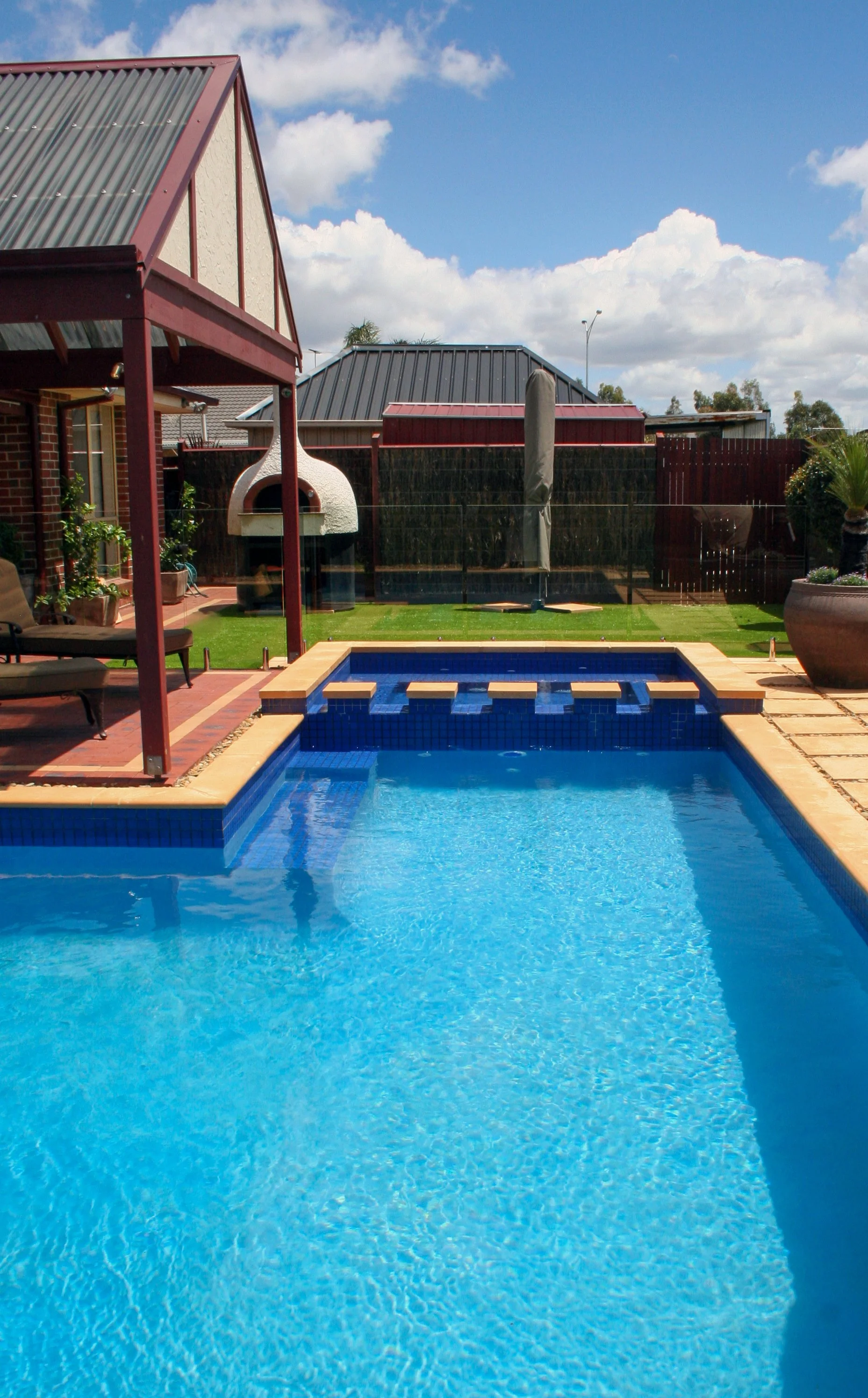 Spa view of a large in-ground family pool in Taylors Hill in the City of Melton.