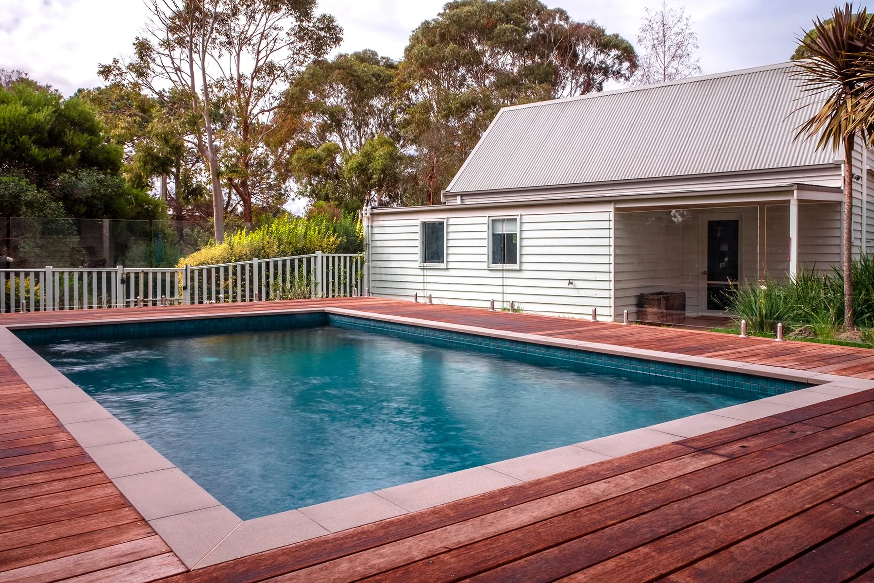 Full view of a good sized family pool in Mount Martha (Mt Martha) on the Mornington Peninsula with blue water and lovely decking area.