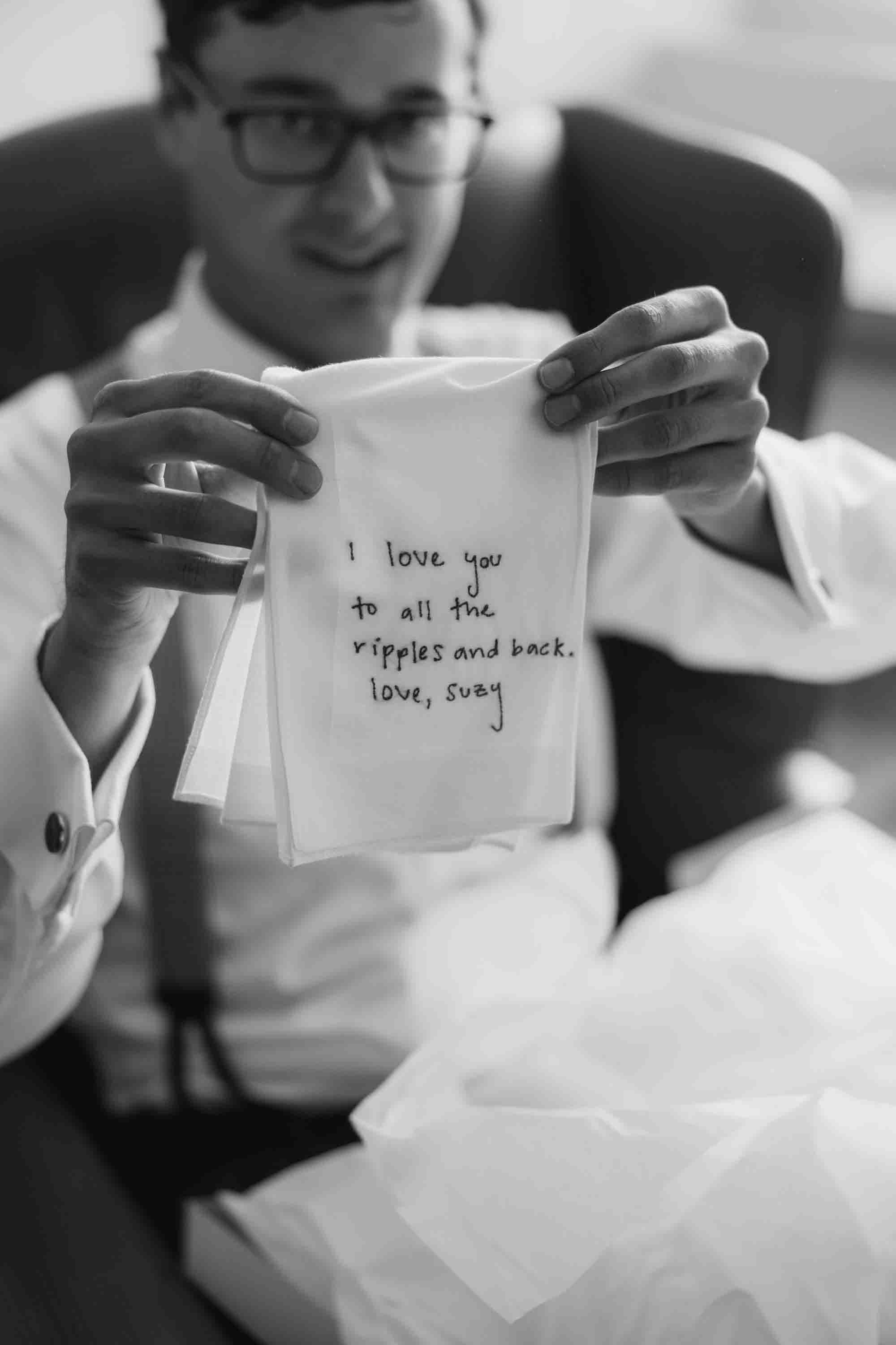 groom reading letter wedding morning emotional detail kiawah island wedding