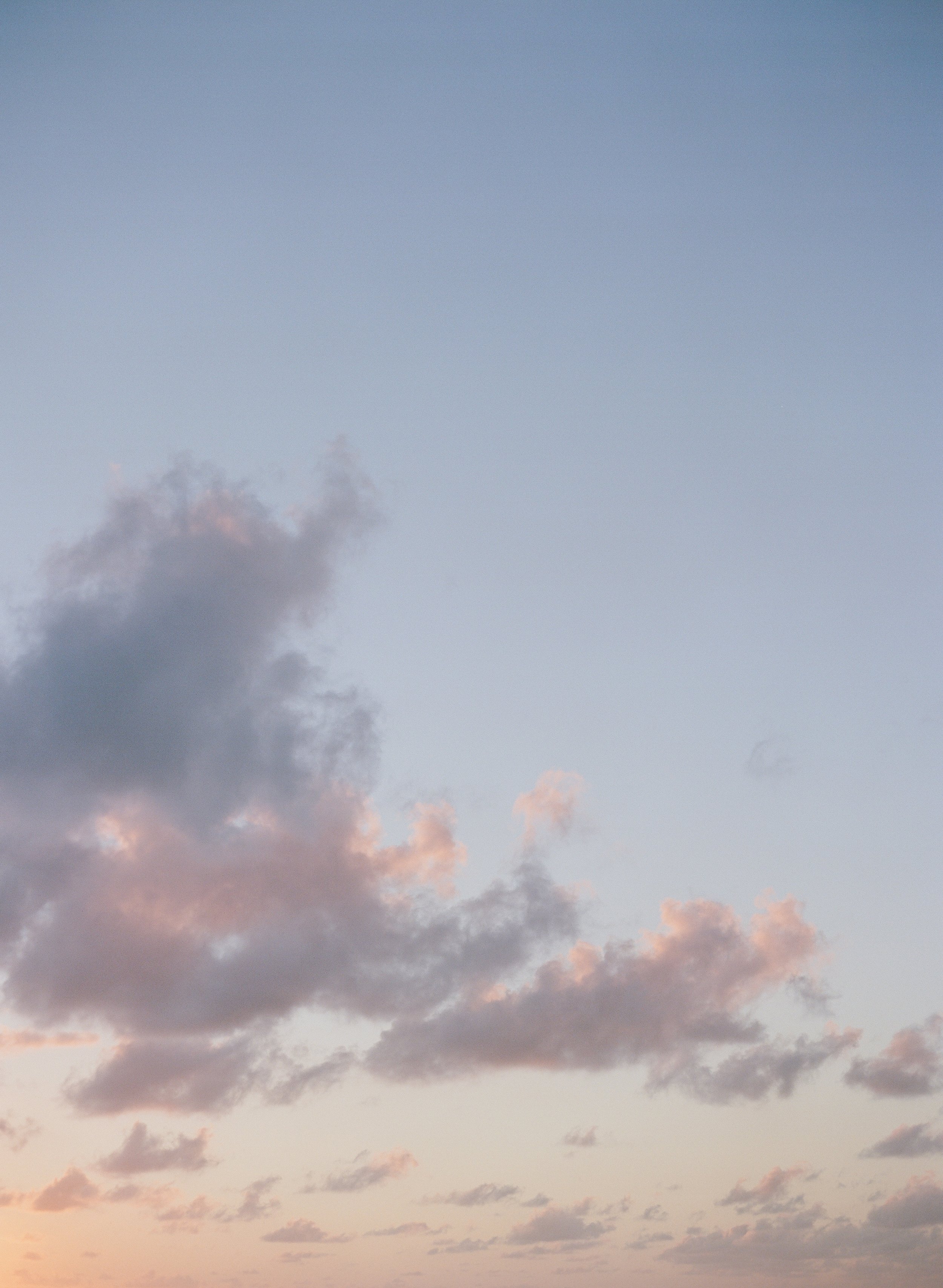 Sky with scattered clouds at either sunrise at Round Hill Hotel and Villas, the iconic, luxury resort located on a private 110-acre peninsula in Montego Bay, Jamaica