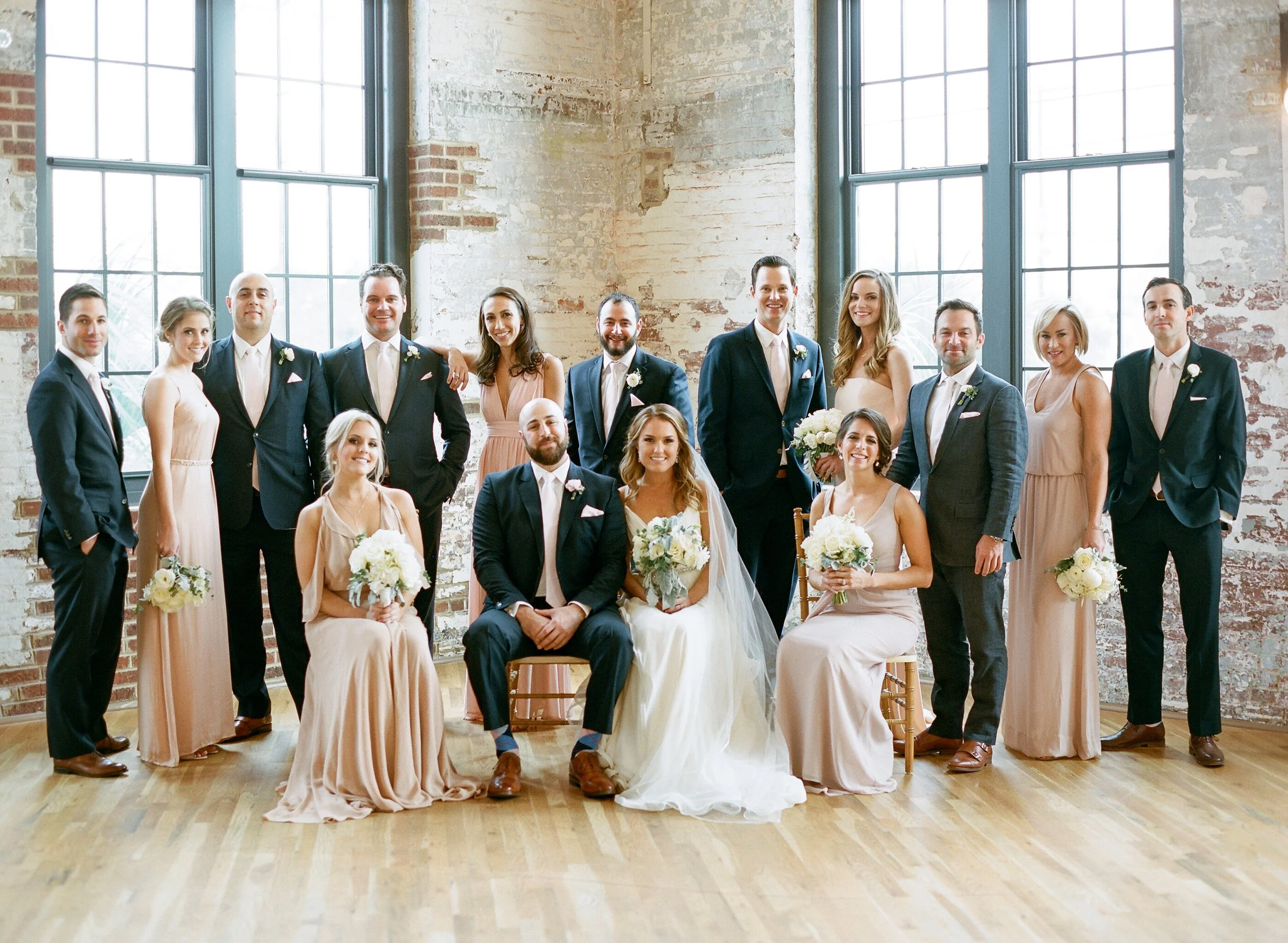 Brick wall portraits at Cedar Room