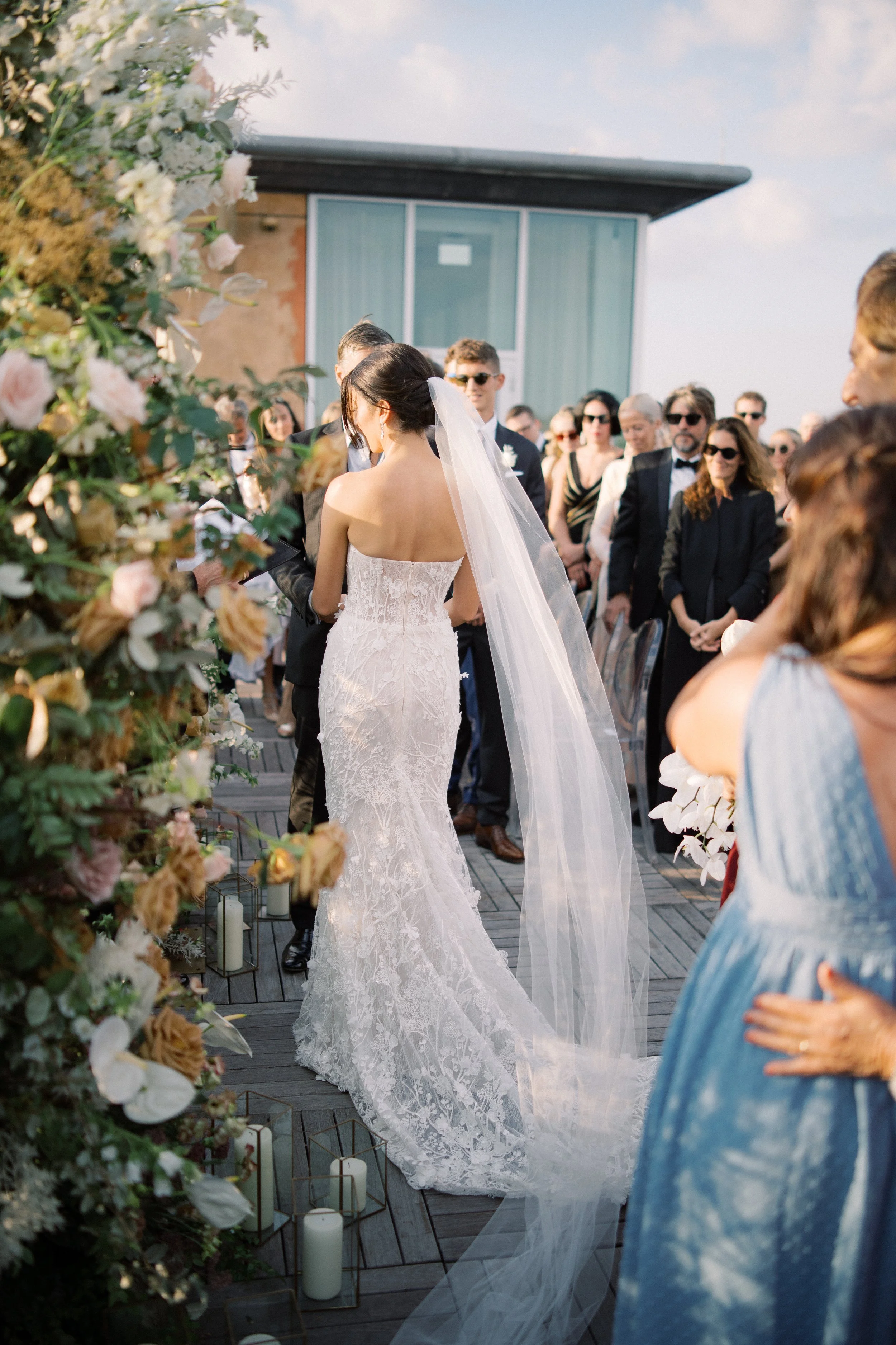Rooftop sunset wedding ceremony at The Dewberry hotel in Charleston