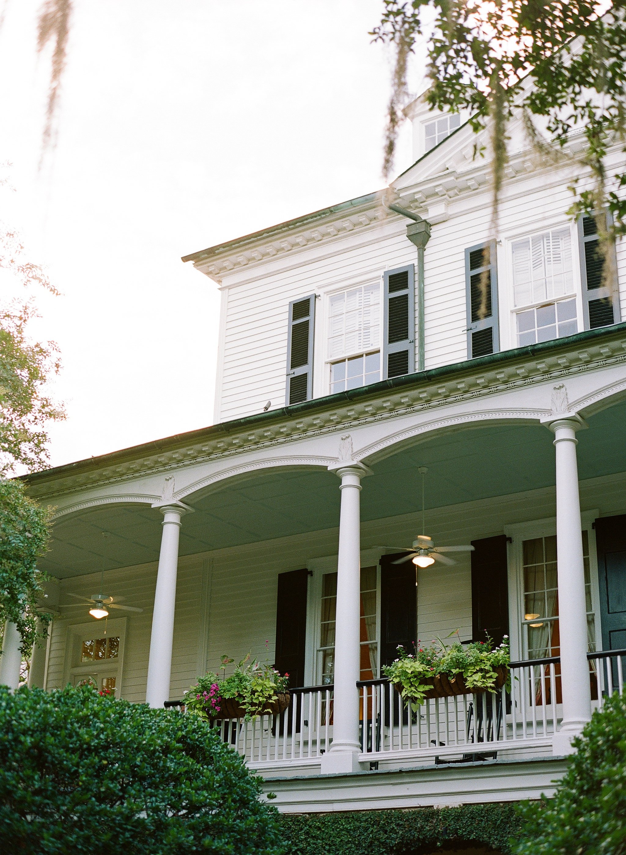 Fine art film wedding portraits at the Governor Thomas Bennett House with historic Charleston architecture