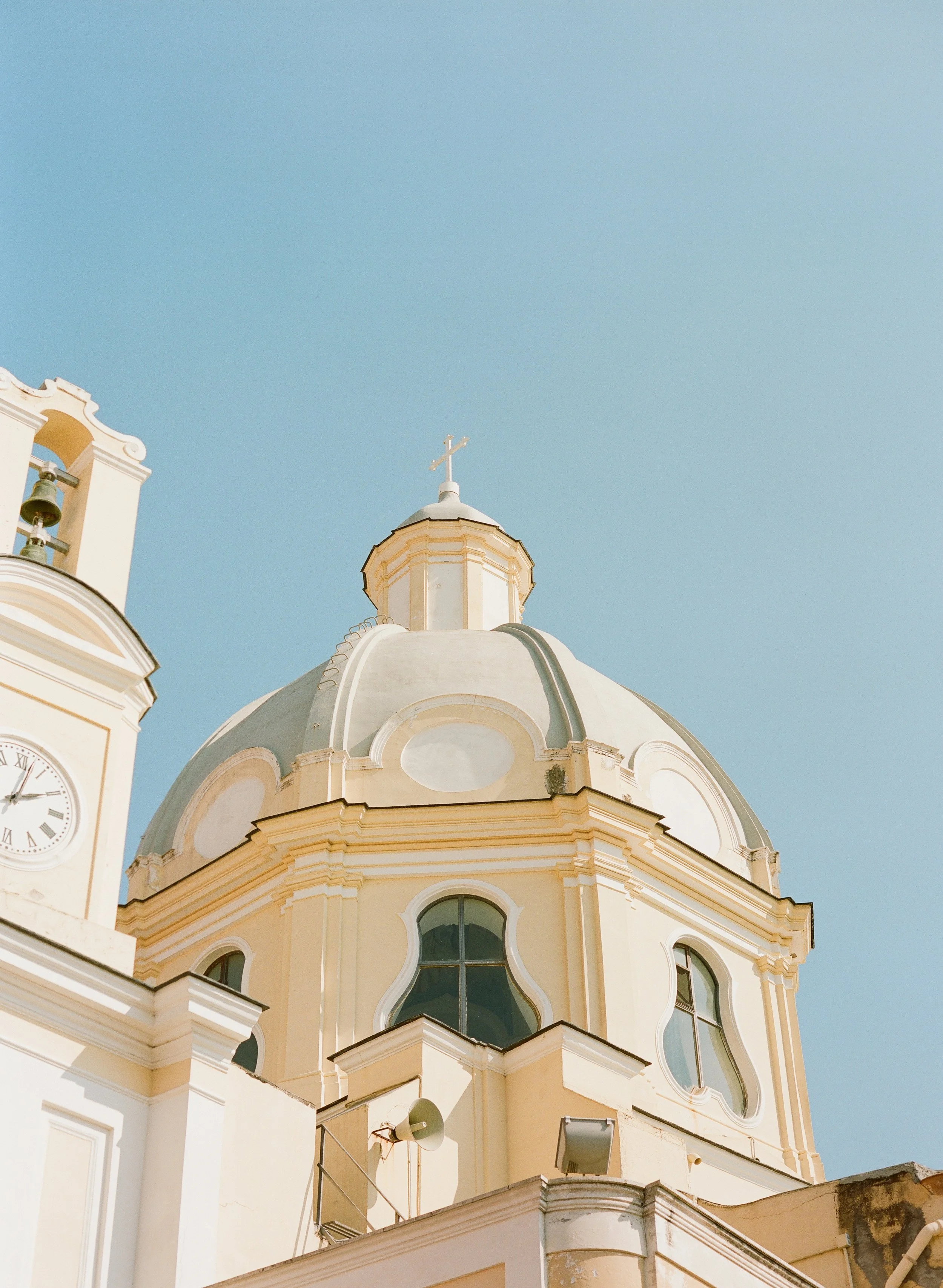 Architectural details and scenic coastline overlooking Sorrento, Italy, a popular destination wedding location.