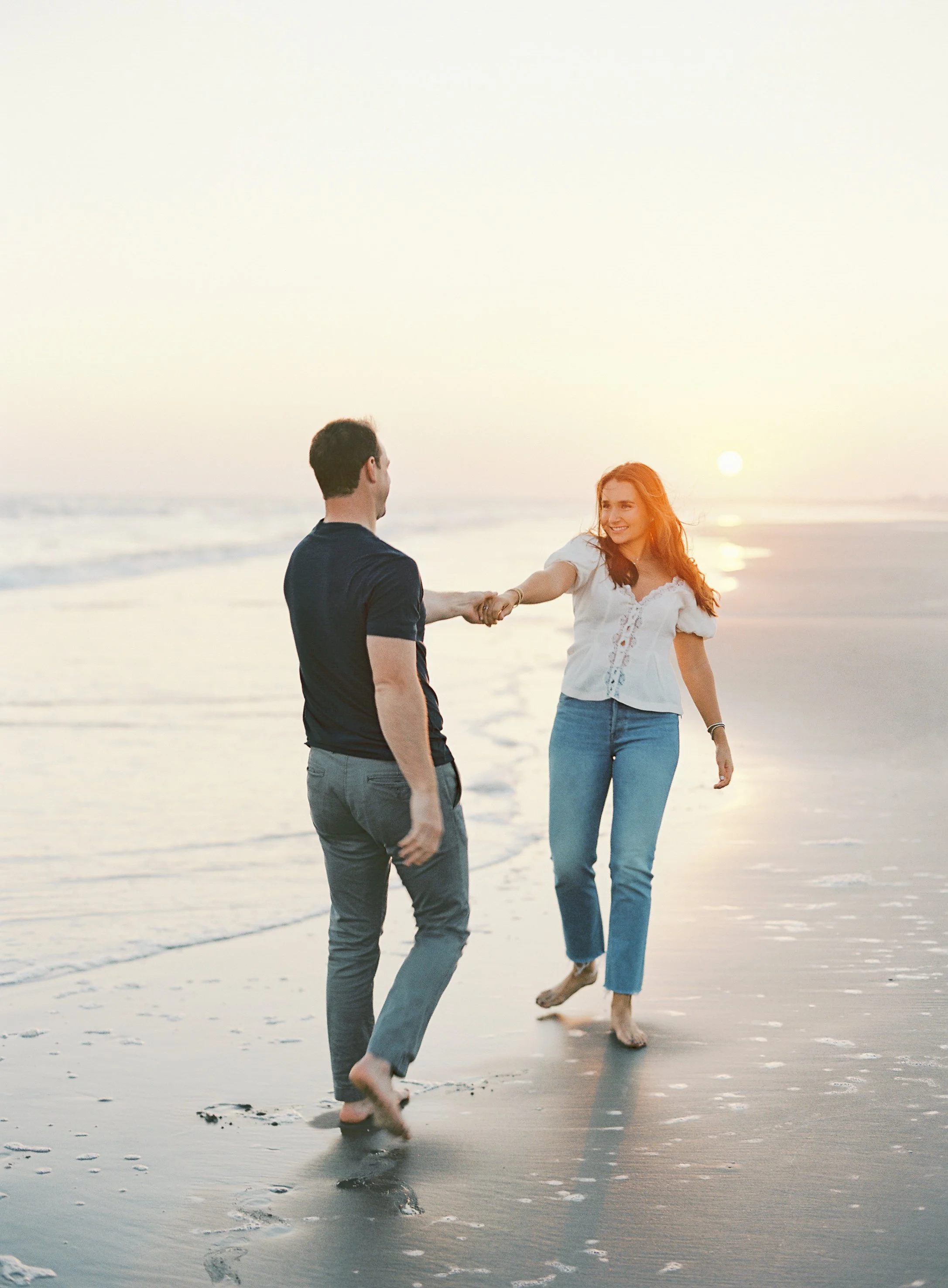 engagement photos at the Ocean Course on Kiawah Island with coastal views