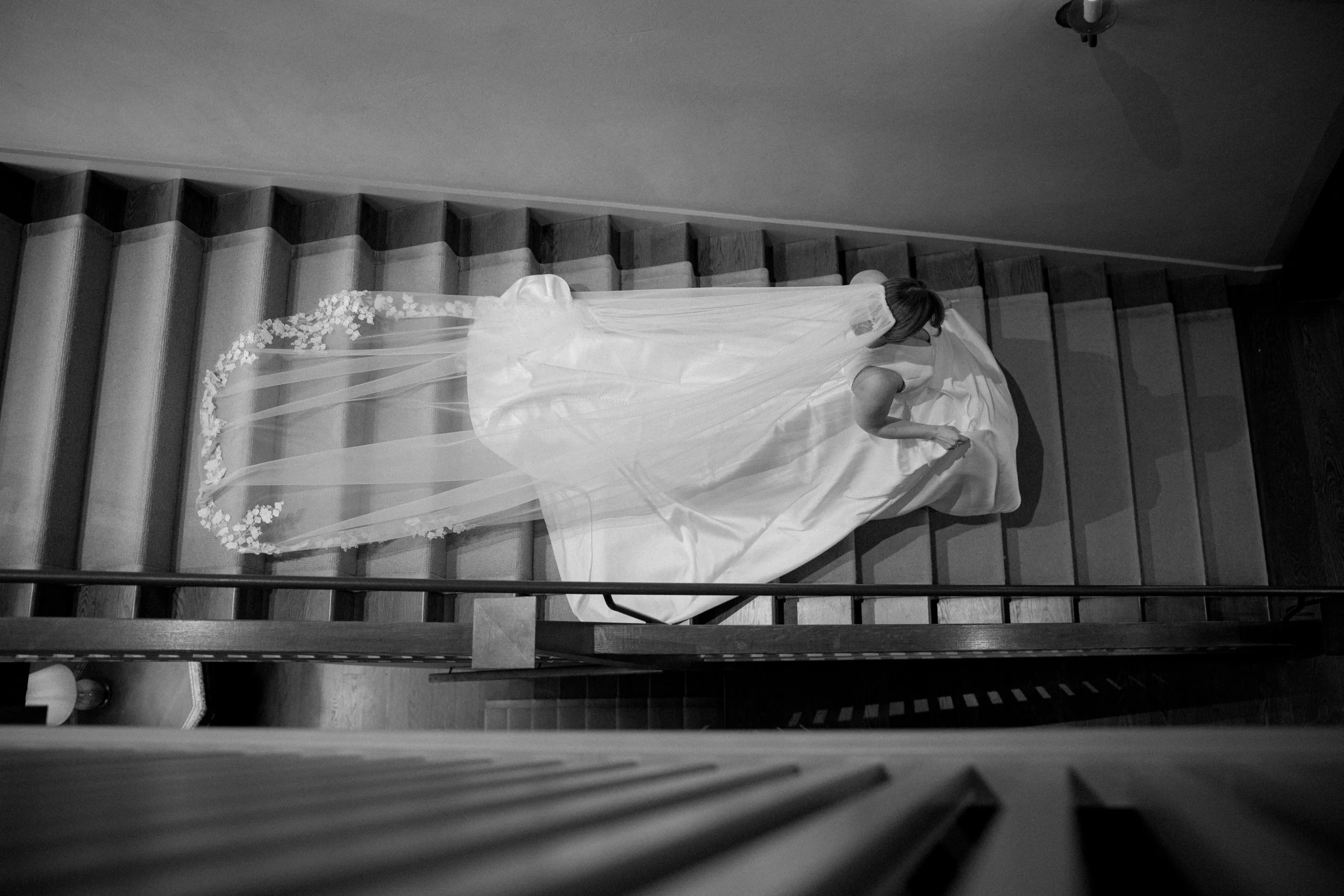 Bride walking down the stairs during a river course wedding on kiawah island, sc