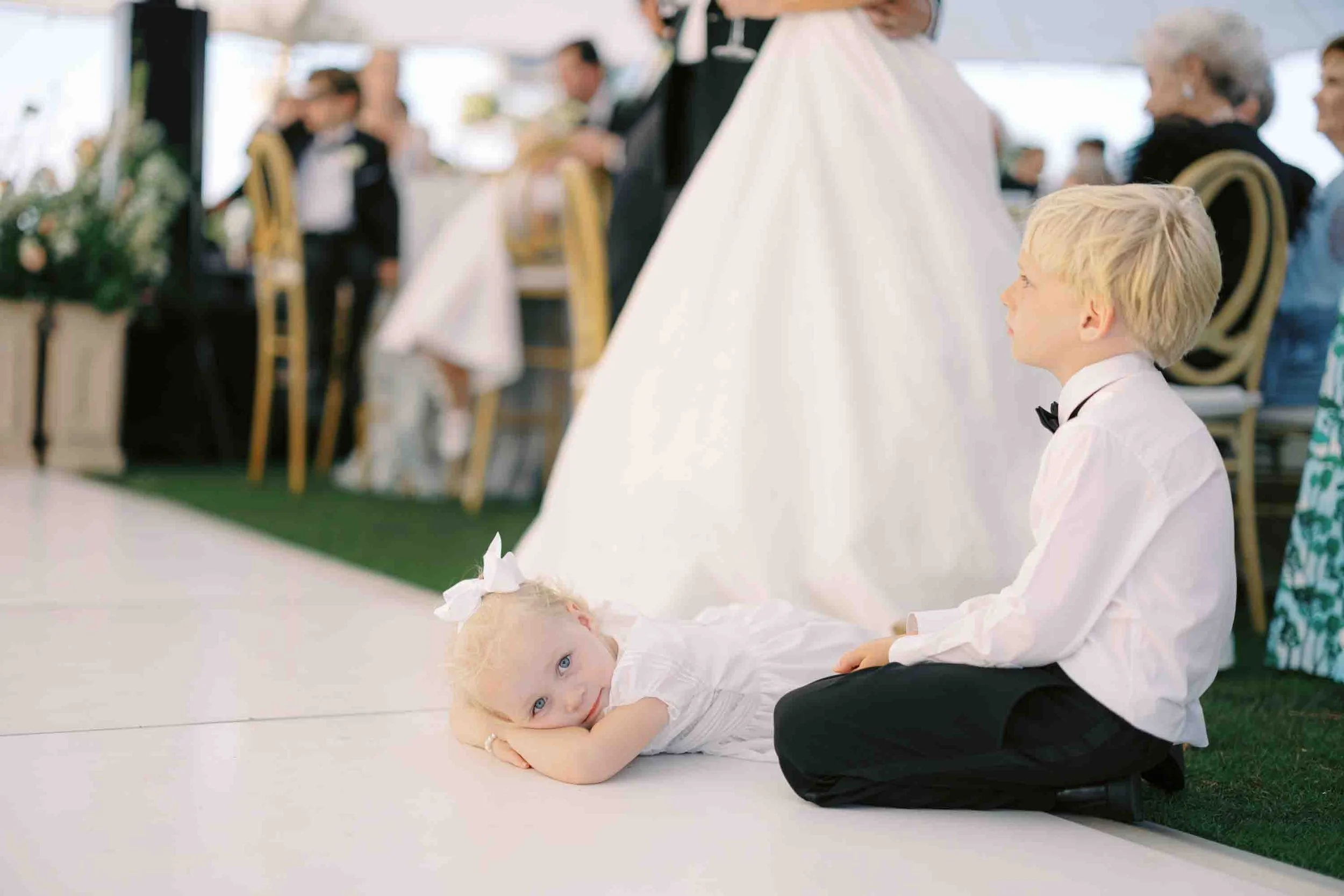 Young children sitting and watching the dance floor during a wedding reception at Kiawah Island
