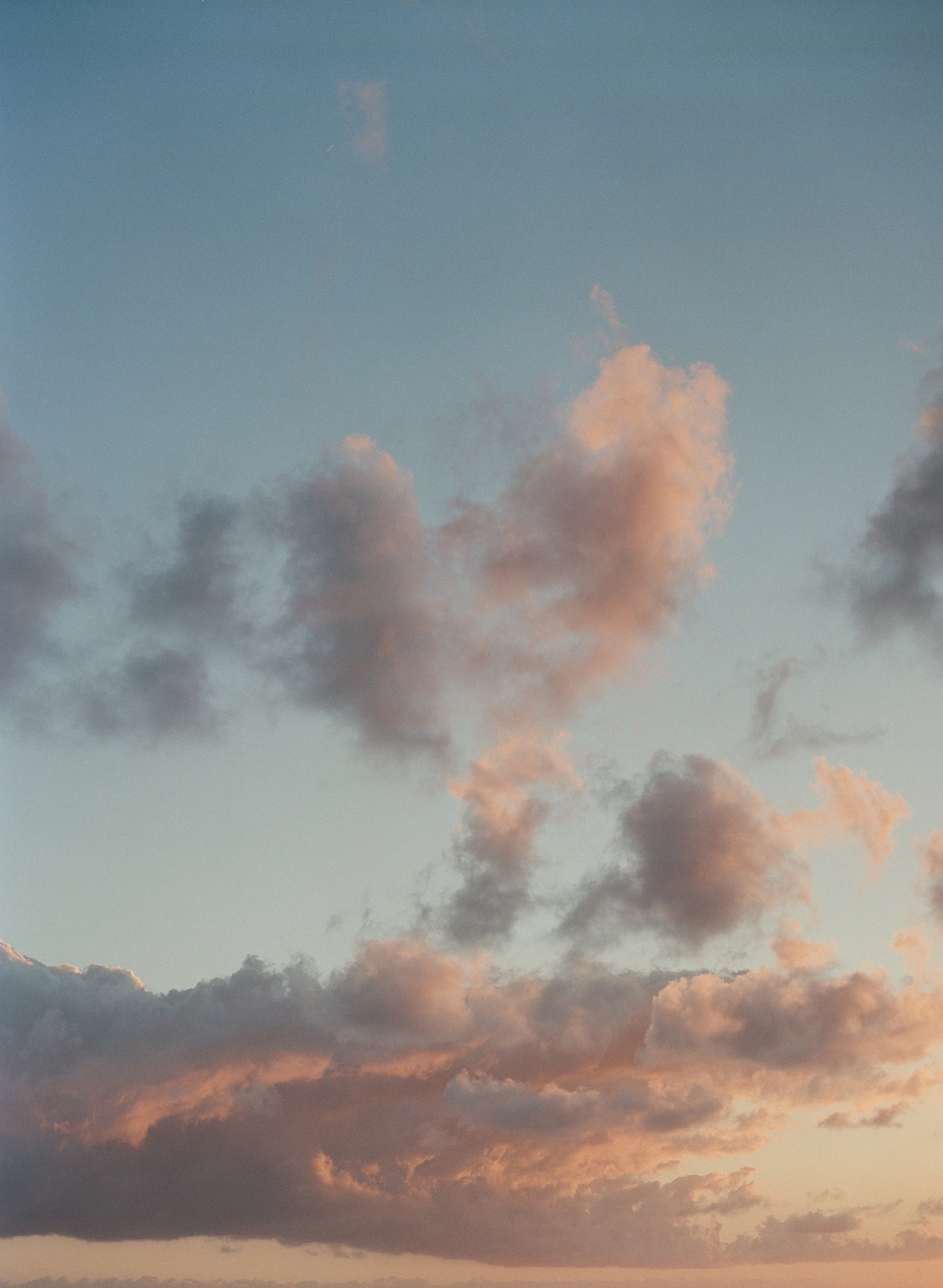 Sky with pink and gray clouds in the Dominican Republic during sunset or sunrise.