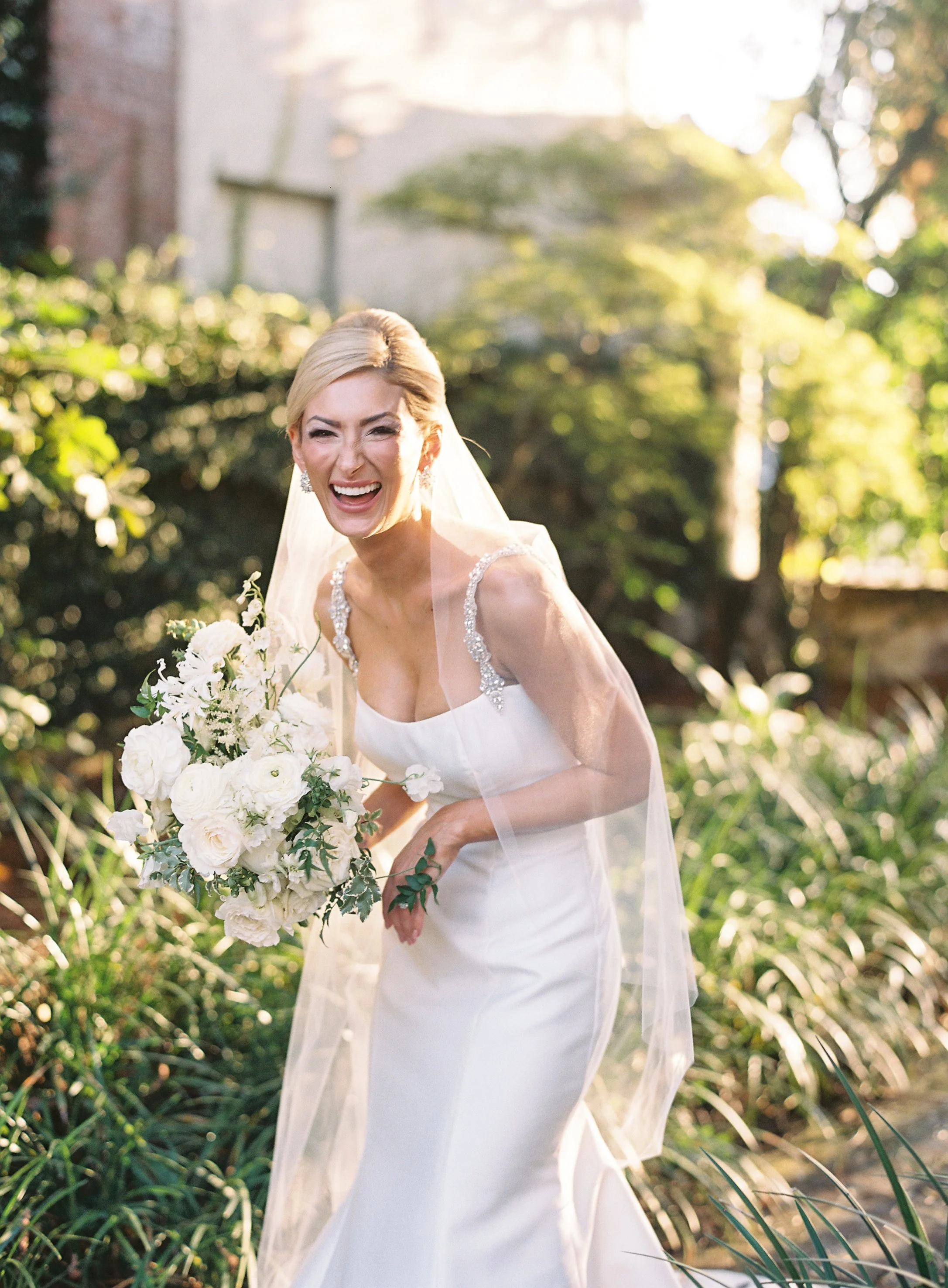 Bride portrait at William Aiken House wedding in Charleston South Carolina with natural light and greenery