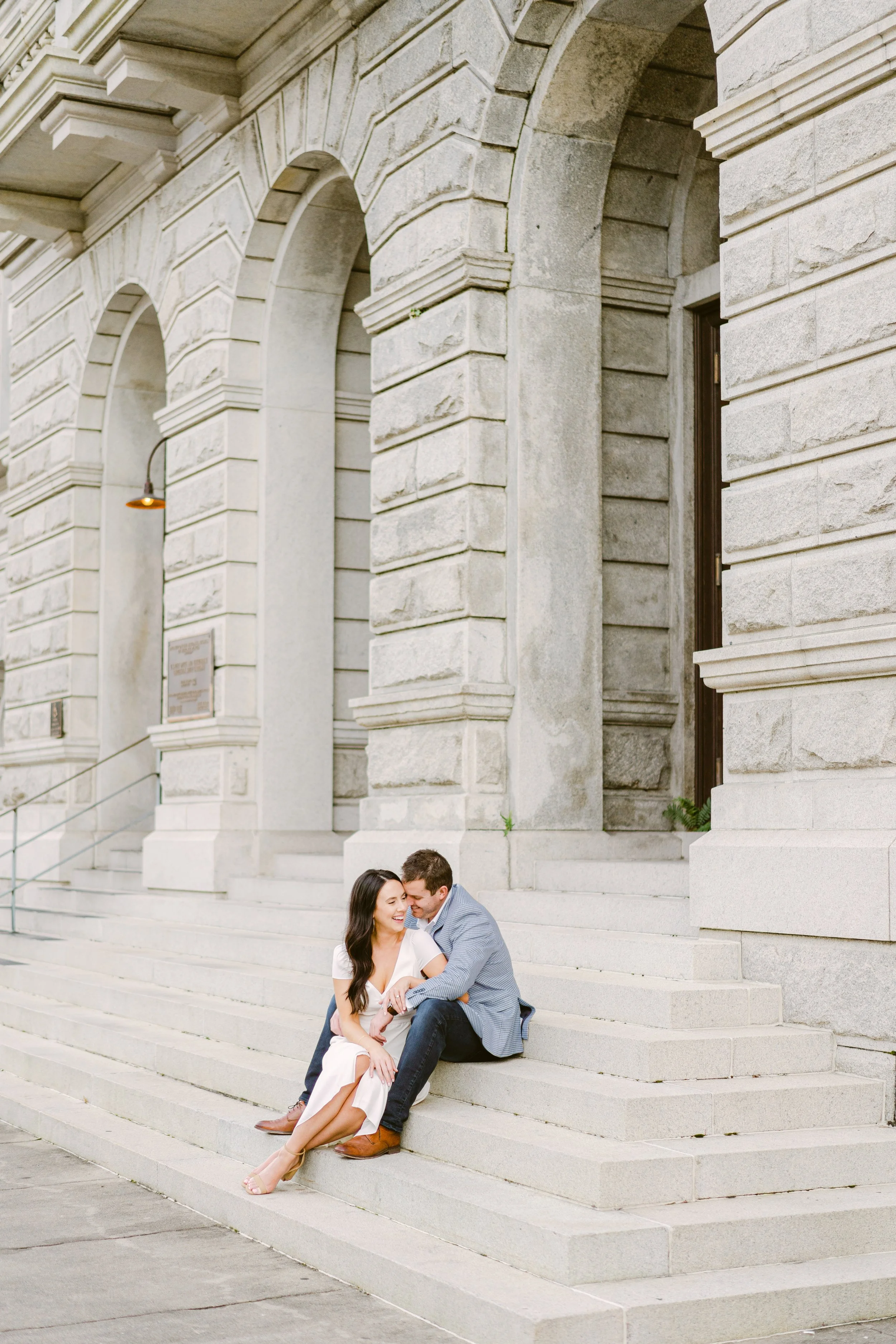 engagement photos on Broad Street near the Four Corners of Law in Charleston