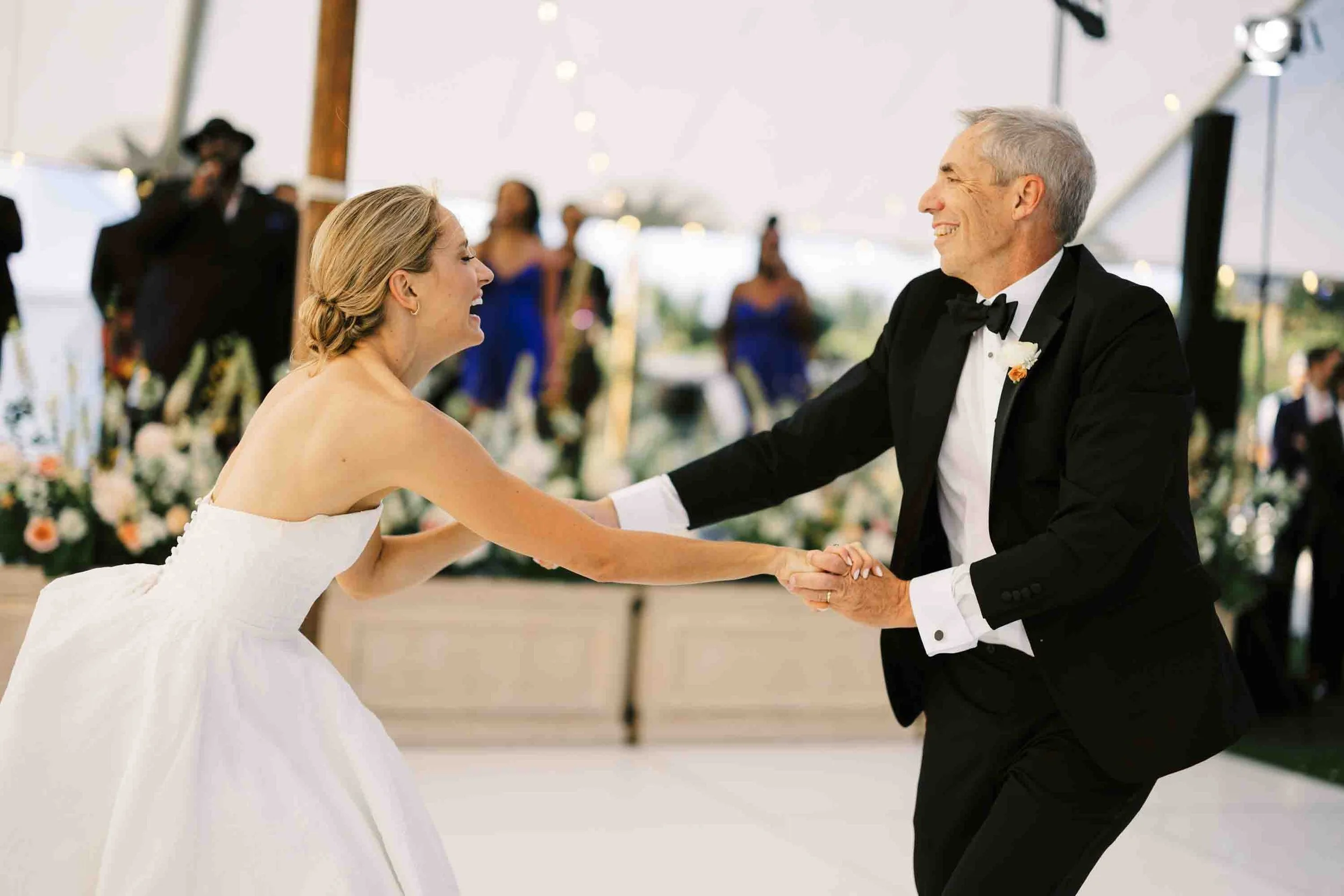 Bride dancing with her father during a heartfelt moment at a Kiawah Island wedding reception