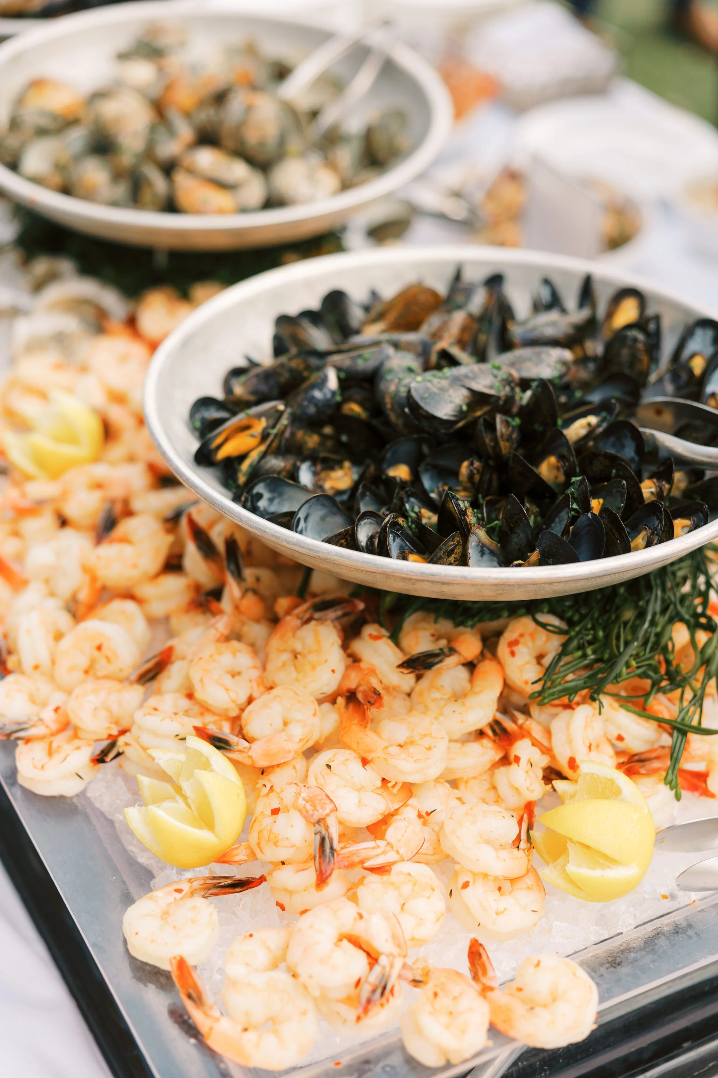 Seafood platter with cooked shrimp, mussels, and lemon wedges served during cocktail hour at the river course on Kiawah Island, SC
