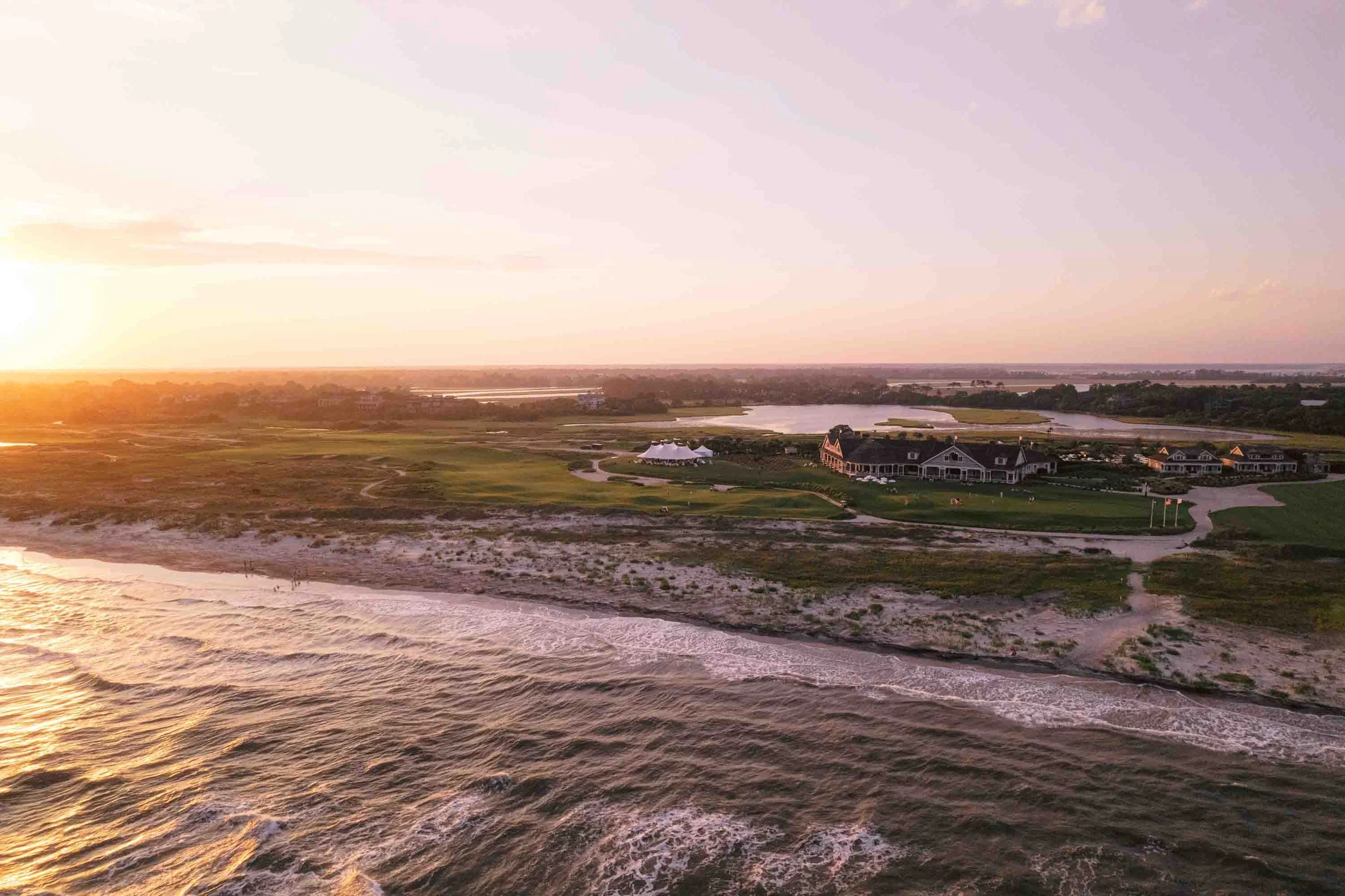 Aerial view of the Ocean Course at Kiawah Island during a coastal wedding reception at sunset