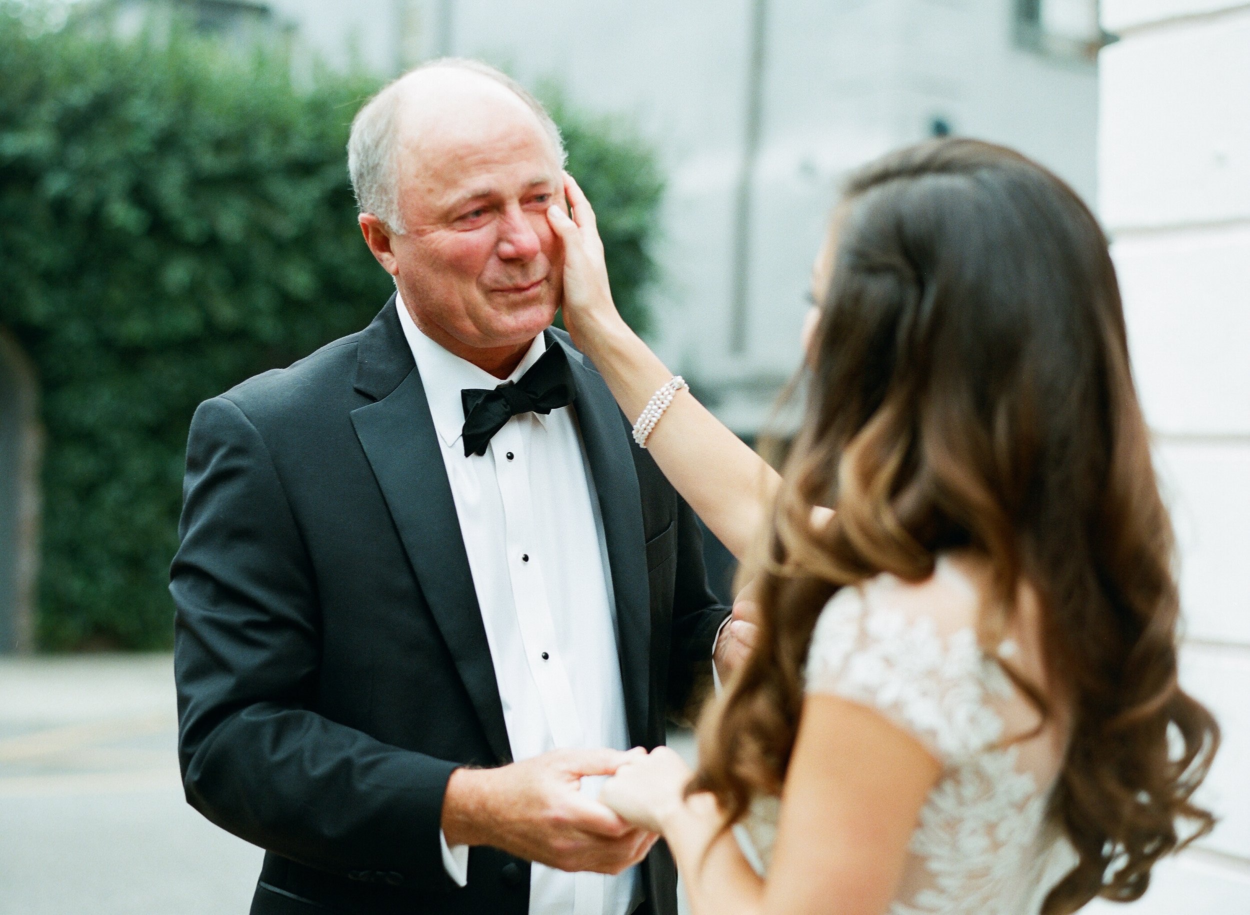 Emotional storytelling moment between bride and her father during first look on wedding day in Charleston SC