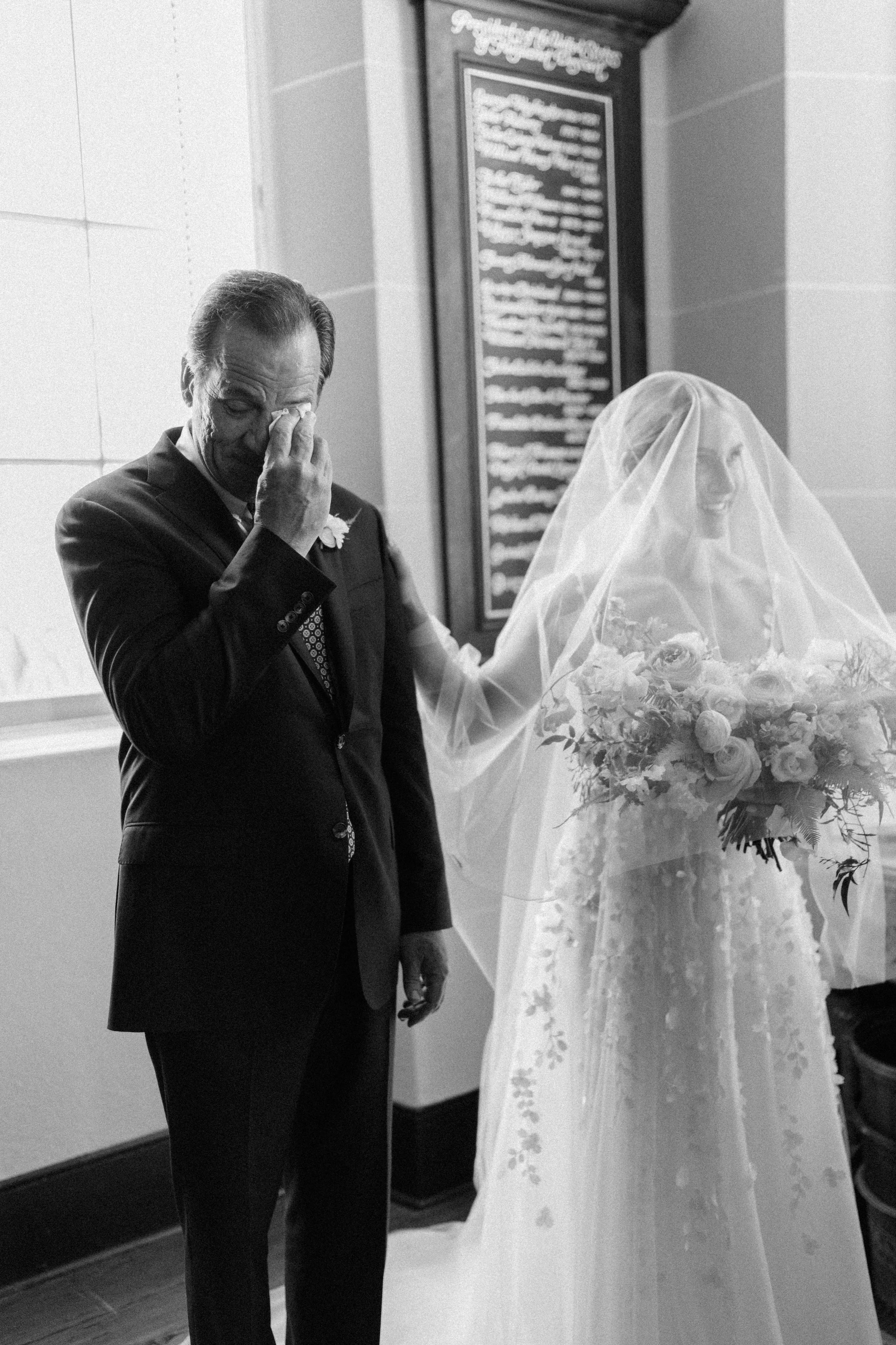 Father crying before walking his daughter down the aisle at French Huguenot Church wedding in Charleston South Carolina