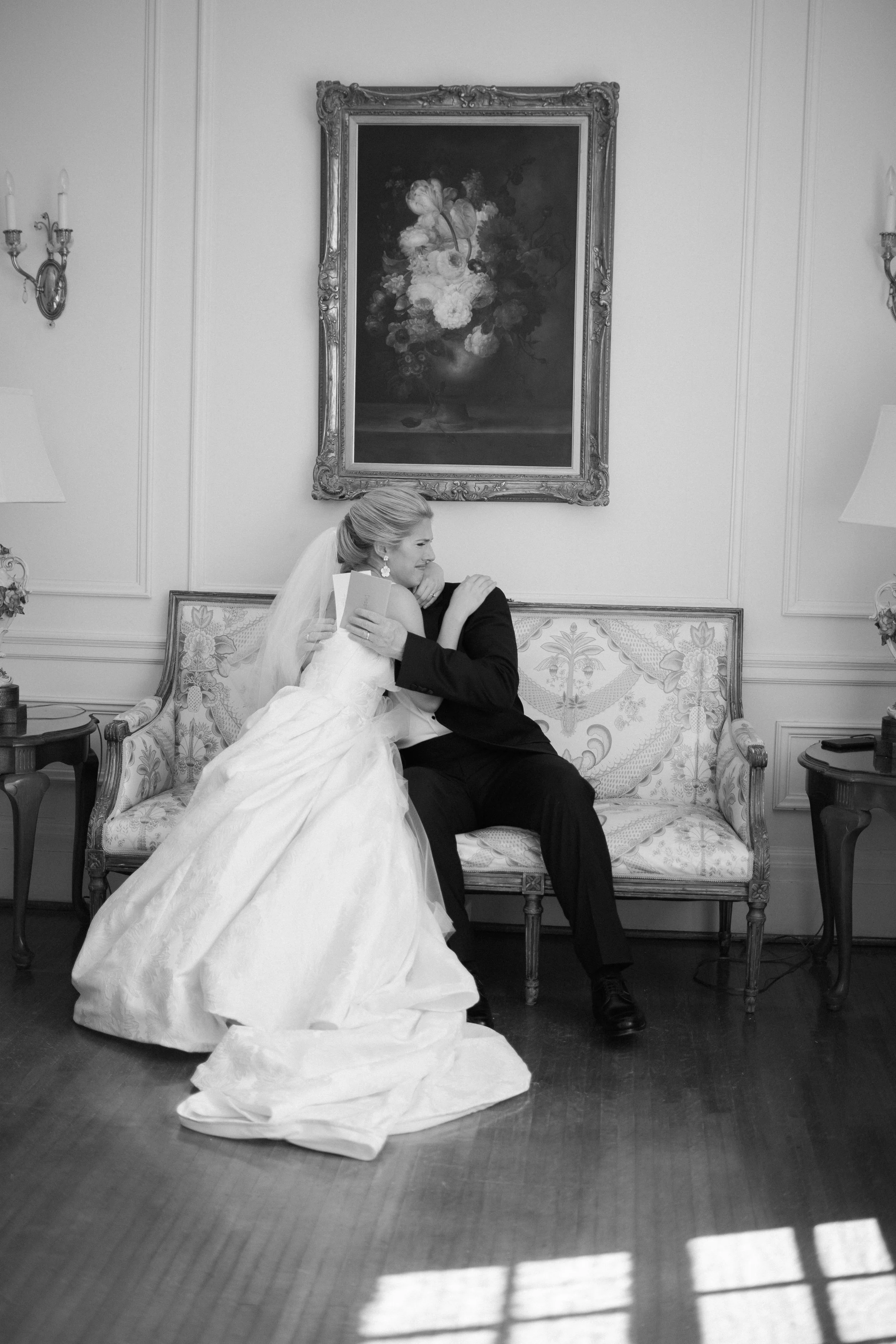 Bride hugging her father during an emotional moment at a wedding in Belmont North Carolina