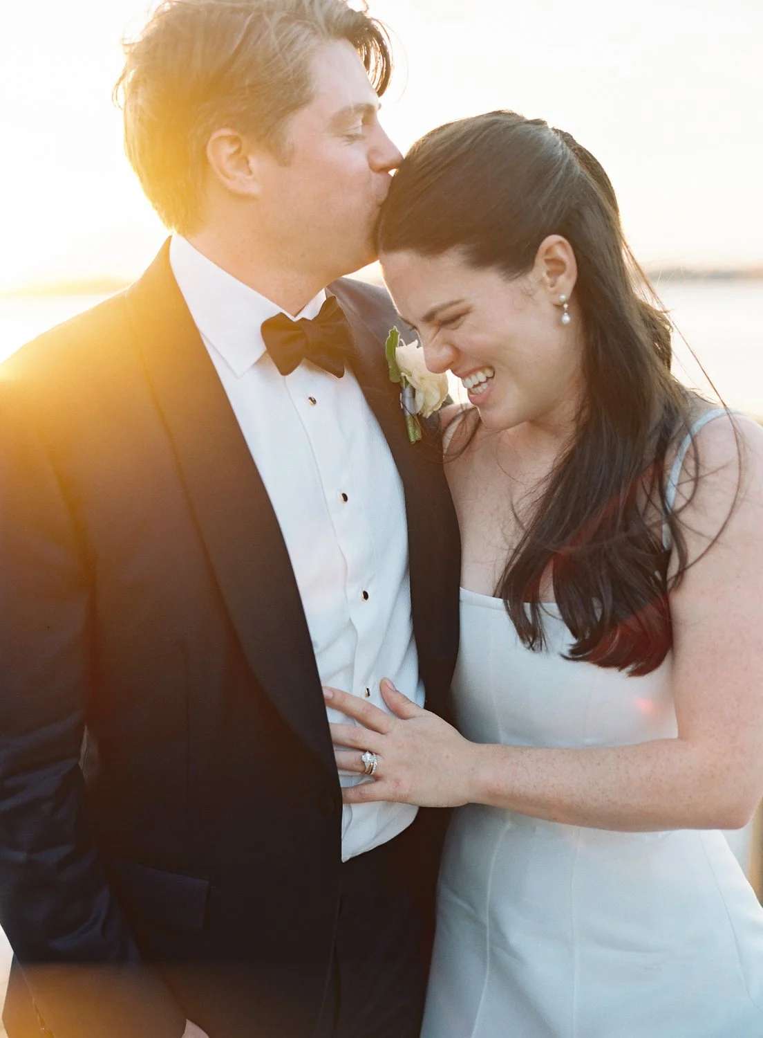Bride and Groom wedding portraits on dock at Lowndes Grove