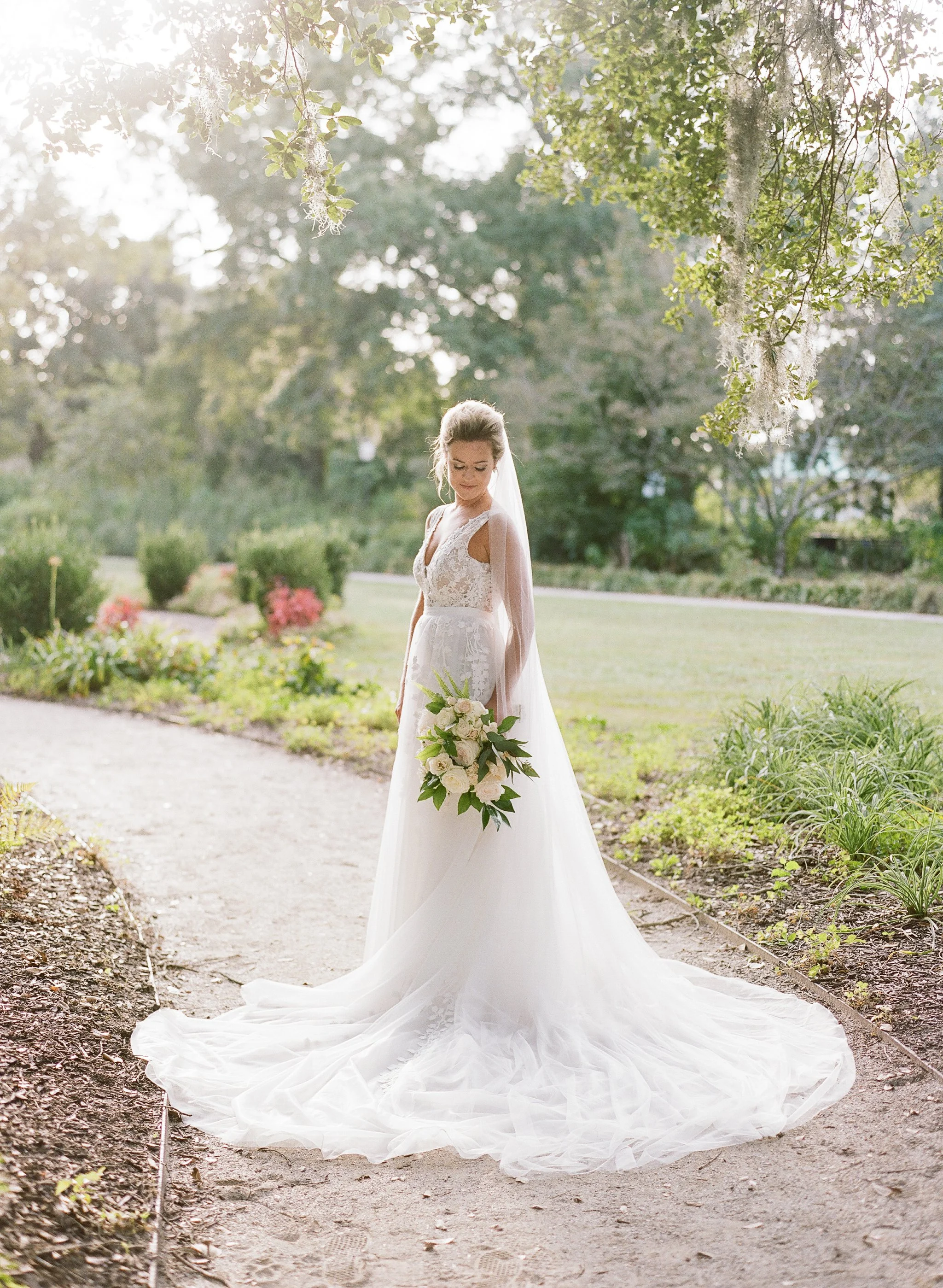 Bride posing for a portrait during her bridal portraits at Hampton Park in Charleston, SC