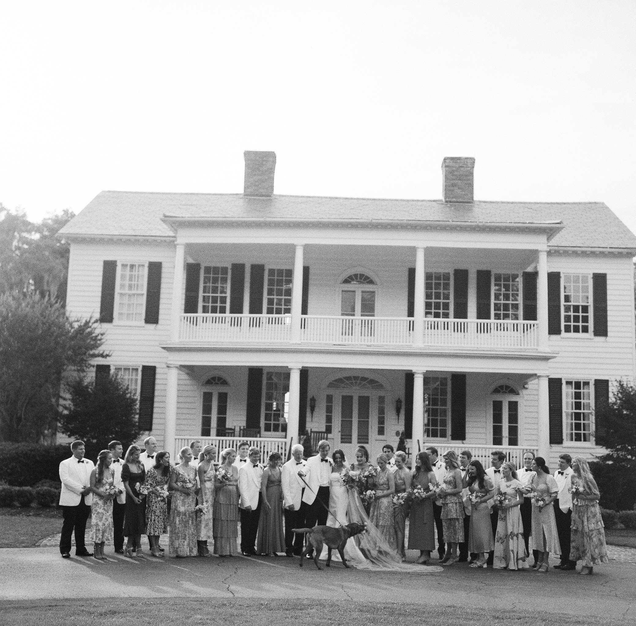 Wedding guests gathered in front of historic Litchfield Plantation in Pawleys Island South Carolina