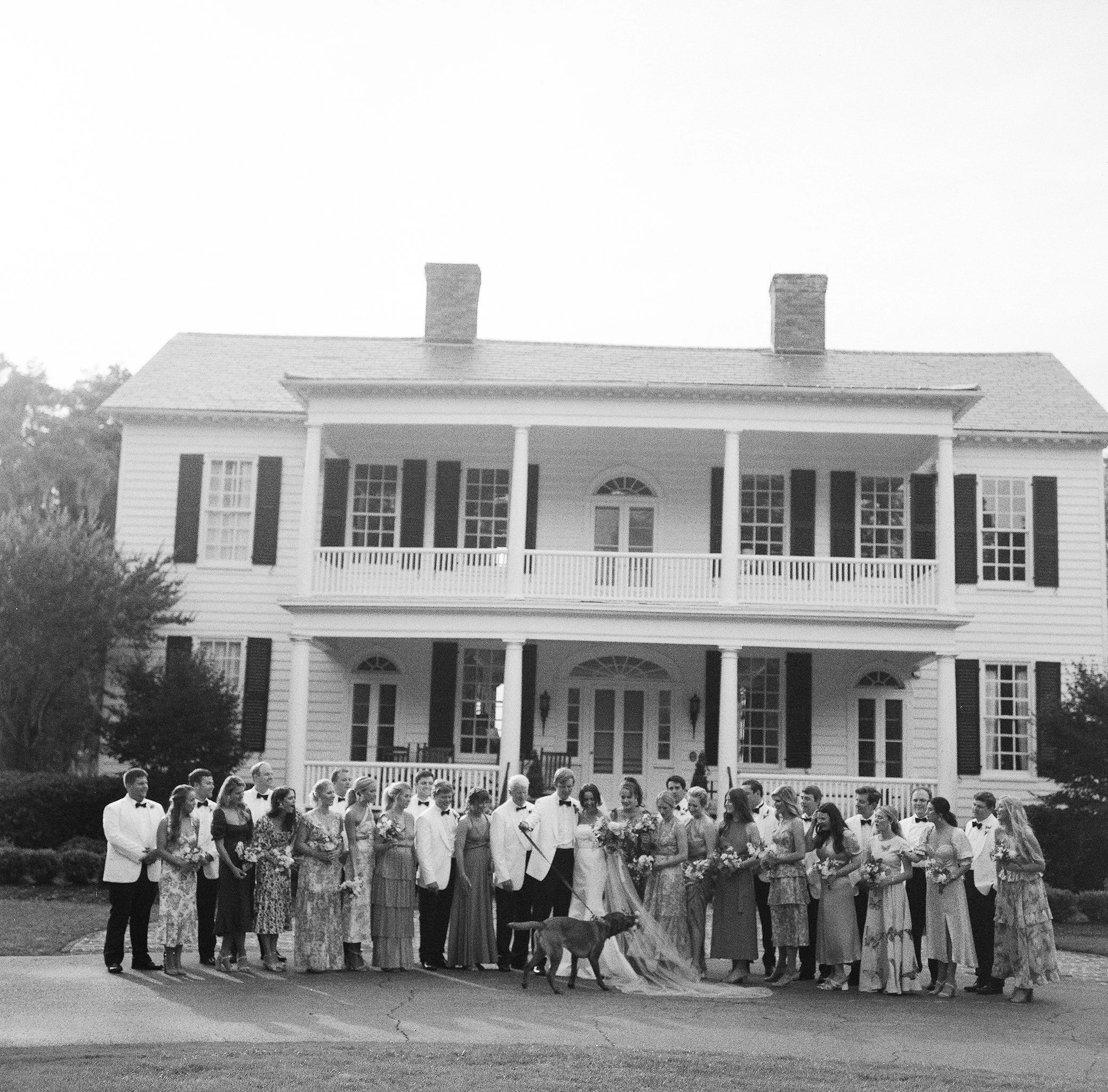 Wedding guests gathered in front of historic Litchfield Plantation in Pawleys Island South Carolina