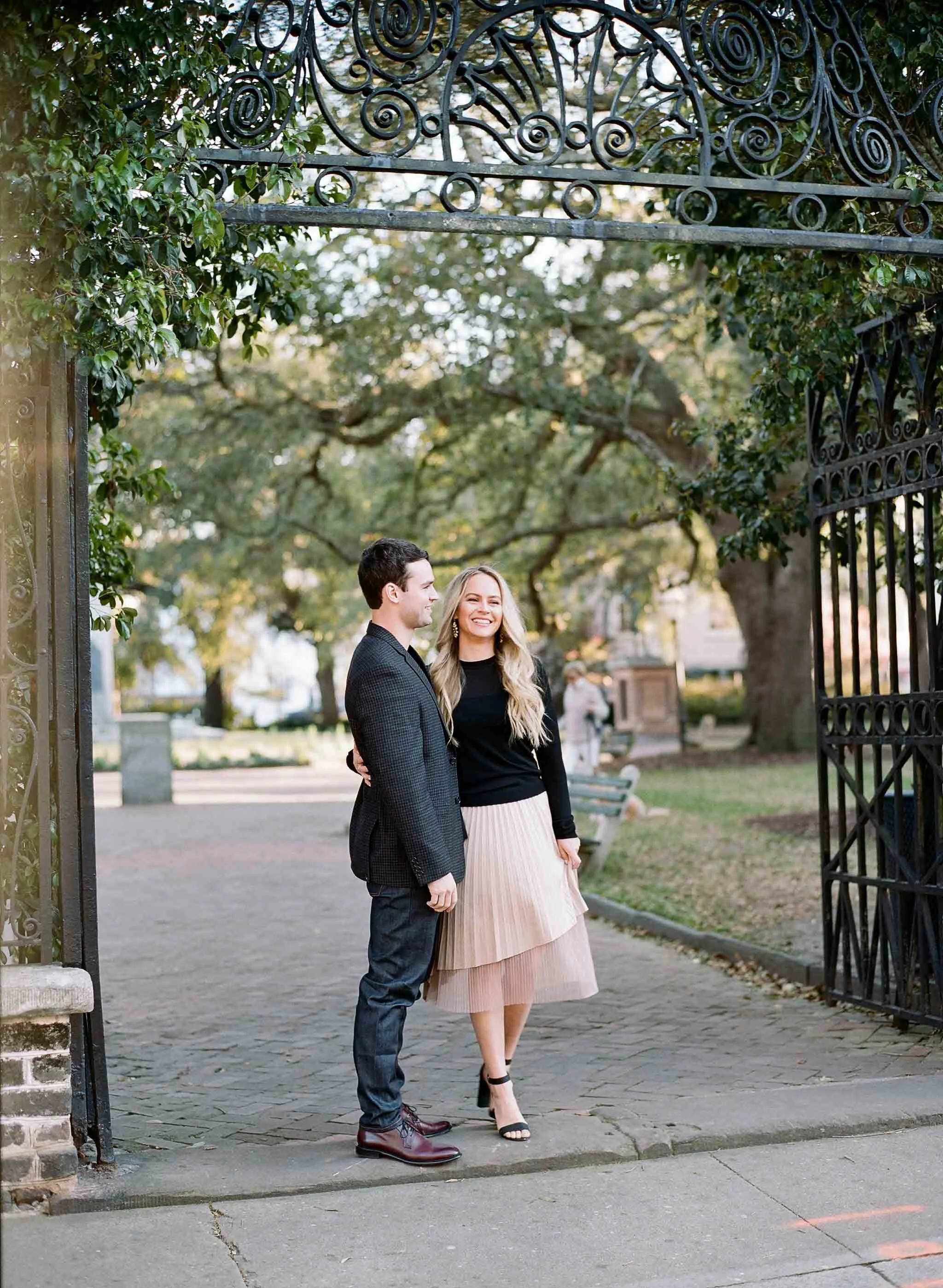engagement photos at Washington Square Park in Charleston with historic surroundings