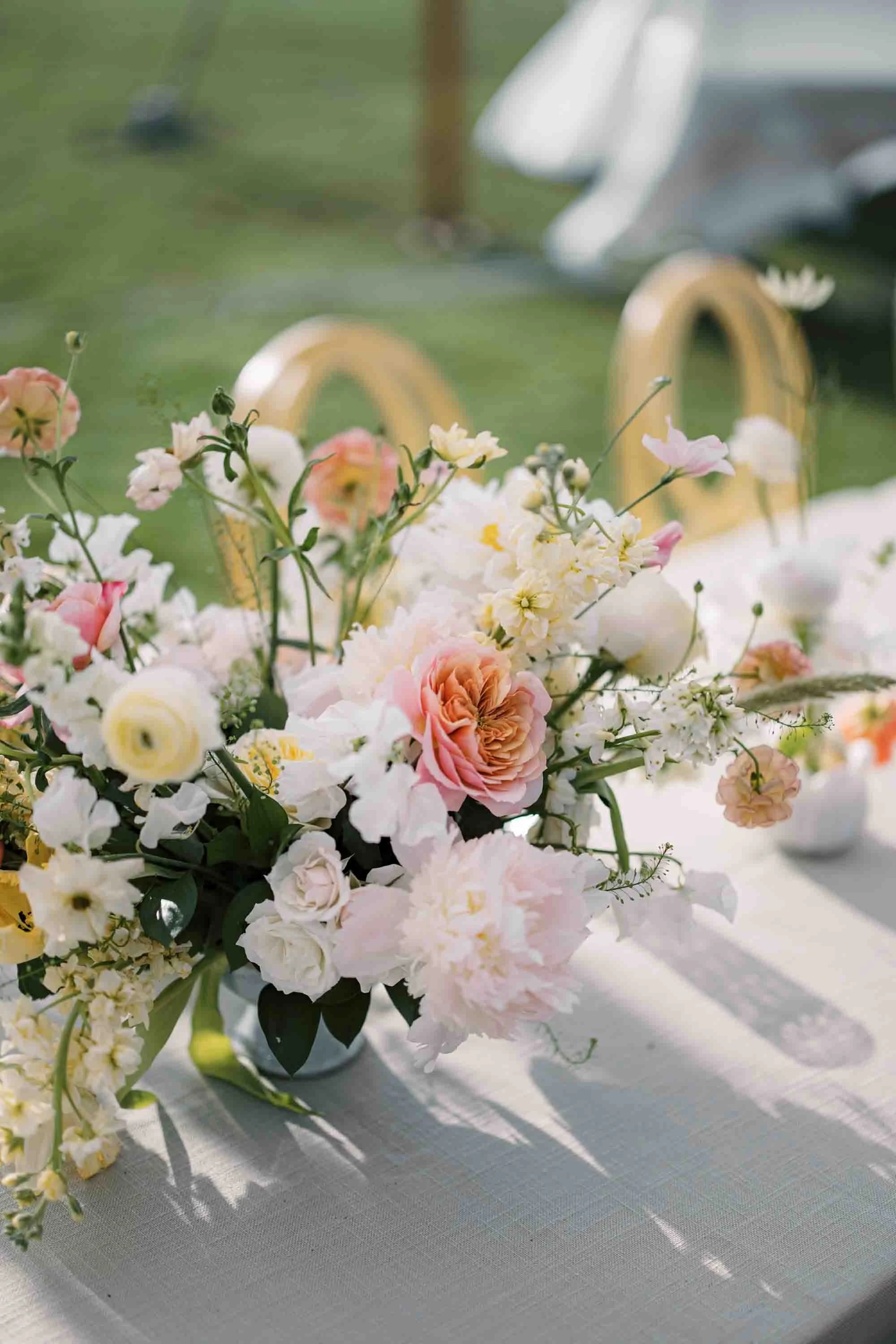 Elegant floral arrangements on reception tables at an Ocean Course wedding on Kiawah Island